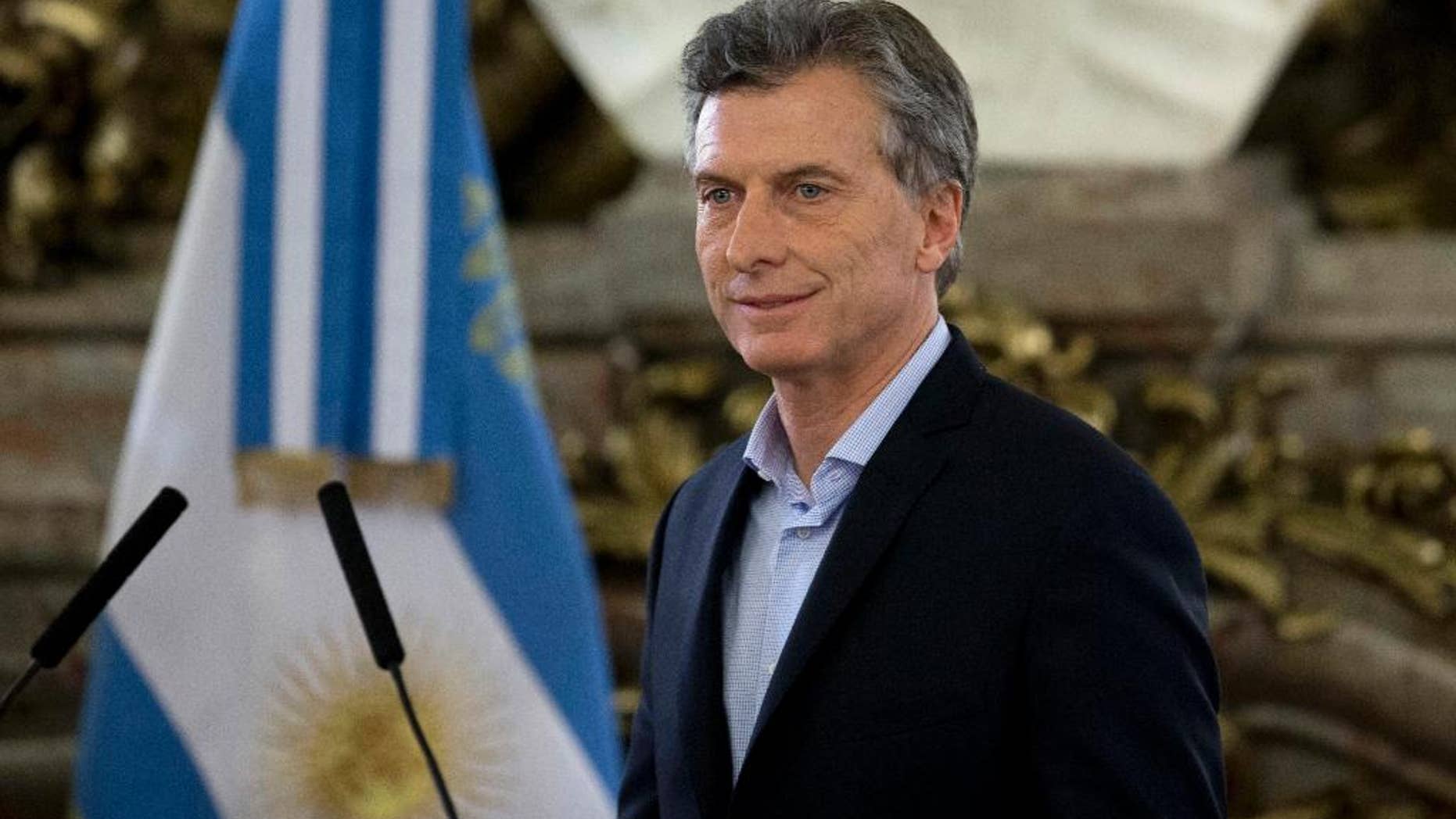 FILE - In this April 7, 2016 file photo, Argentina's President Mauricio Macri arrives at government house in Buenos Aires, Argentina. The presidency said in a statement Friday, June 3, 2016, that Macri suffered from a “light arrhythmia” at around 3 p.m. local time. But he carried on working normally at the presidential residence in the outskirts of Buenos Aires. The 57-year-old Macri was later checked into a hospital for precautionary studies. (AP Photo/Natacha Pisarenko, File)