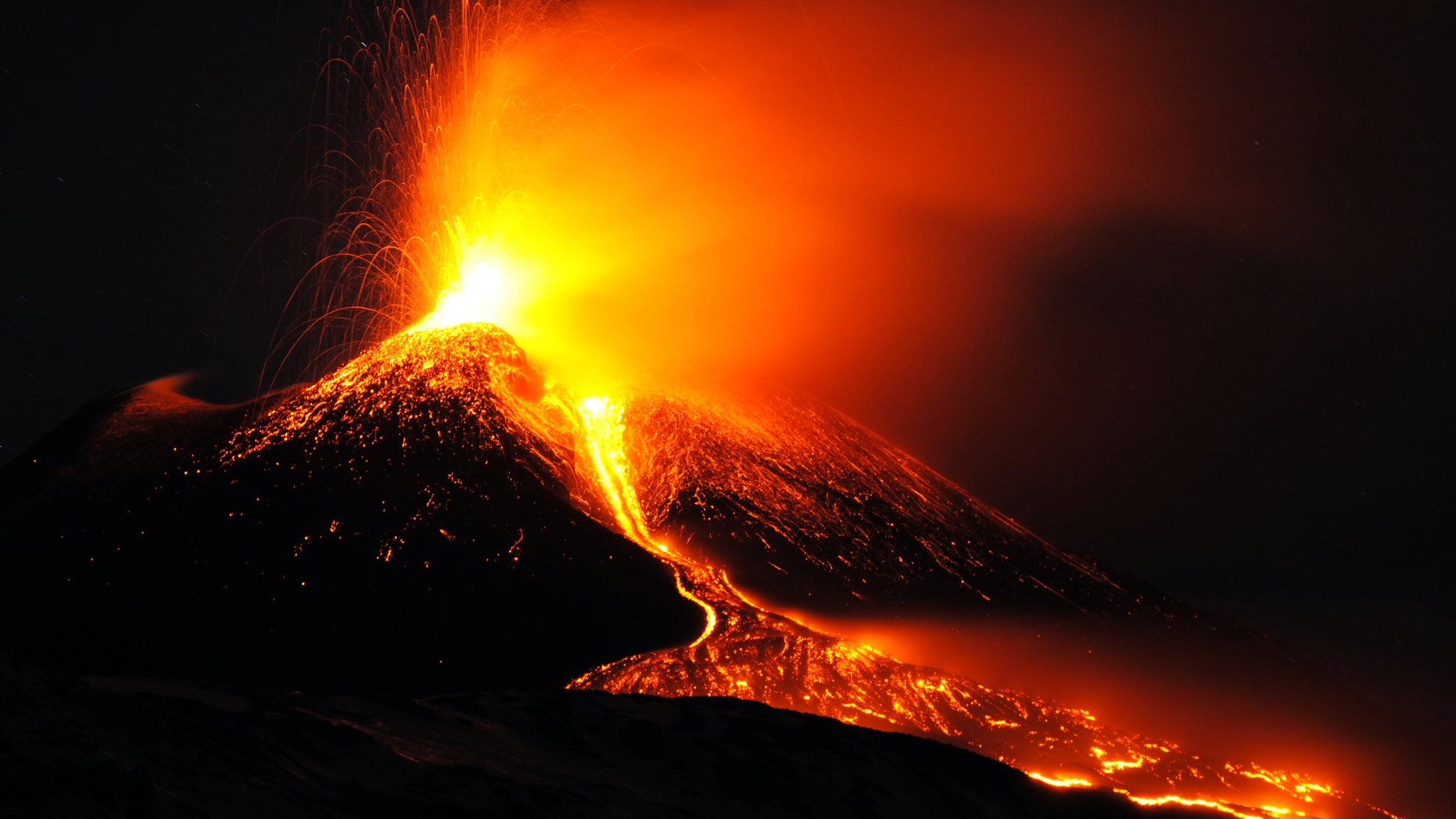 FILE - In this Sunday, Dec. 15, 2013 filer, Mt. Etna volcano spews lava during an eruption near the Sicilian town of Catania, Italy. Ash fallout from Mount Etna's latest spectacular eruption has forced the closure of Catania's airport in eastern Sicily.The airport said it would remain closed at least until Monday evening. Several flight departures and arrivals were canceled, and at least two flights were diverted to Palermo's airport in the western part of the Mediterranean island. Etna is Europe's most active volcano. Its latest series of eruptions has lasted for weeks now, occasionally causing a change in flight routes. The eruption hasn't forced evacuation of the villages on the mountain's slopes. Its last major eruption occurred in 1992. (AP Photo/Salvatore Allegra, File)