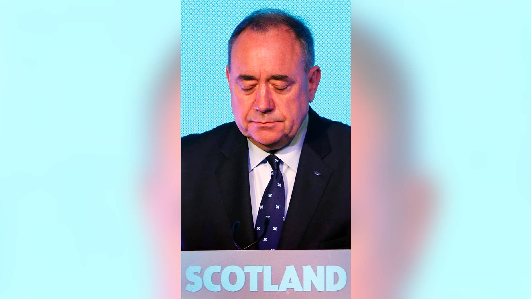 Scottish First Minister Alex Salmond looks down during a press conference in Edinburgh, Scotland, Friday, Sept. 19, 2014. Scottish voters have rejected independence and decided that Scotland will remain part of the United Kingdom. The result announced early Friday was the one favored by Britain's political leaders, who had campaigned hard in recent weeks to convince Scottish voters to stay. It dashed many Scots' hopes of breaking free and building their own nation. (AP Photo/PA, Danny Lawson) UNITED KINGDOM OUT, NO SALES, NO ARCHIVE
