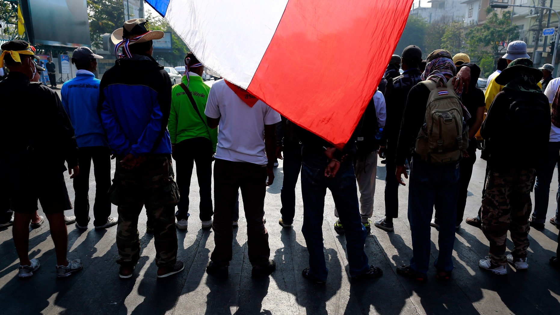 Anti-government protesters make their way on a street during a march Friday, Jan. 24, 2014 in Bangkok. Thailand’s Constitutional Court ruled Friday that nationwide elections scheduled for Feb. 2 can legally be delayed. (AP Photo/Wason Wanichakorn)