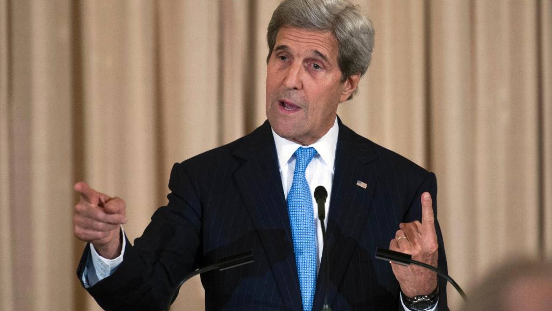 FILE - In May 3, 2106 file photo, Secretary of State John Kerry speaks at the State Department in Washington. Diplomats say the U.S. will endorse a tough new tone with Israel in an upcoming international report. The report would take the Jewish state to task over settlements, demolitions and property seizures on land the Palestinians claim for a future state. (AP Photo/Cliff Owen, File)
