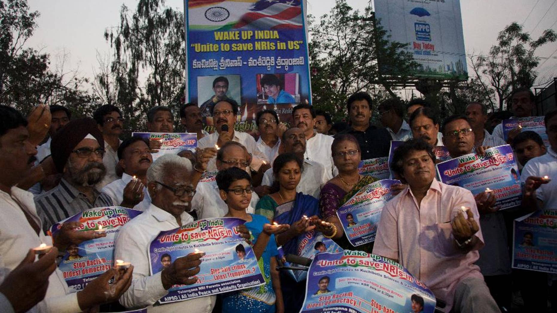 Parents of Indians living abroad are joined by others to participate in a candlelight vigil to pay their tributes to Srinivas Kuchibhotla in Hyderabad, India, Thursday, March 9, 2017. Kuchibhotla, a 32-year-old engineer who was killed in an apparently racially motivated shooting in a crowded Austin's Bar and Grill in Olathe, Kansas, a suburb of Kansas City last month. (AP Photo/Mahesh Kumar A.)