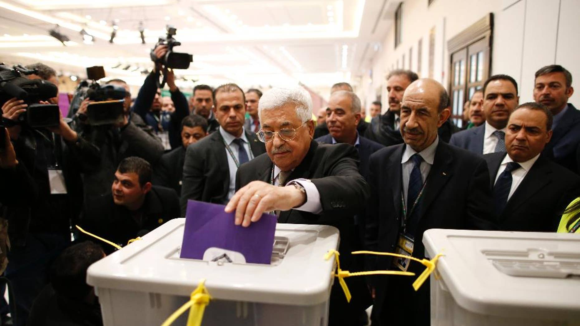 Palestinian president Mahmud Abbas casts his vote at the Muqataa, the Palestinian Authority headquarters, in the city of Ramallah, West Bank, Saturday Dec. 3, 2016. (Ahmad Gharabli/Pool photo via AP)