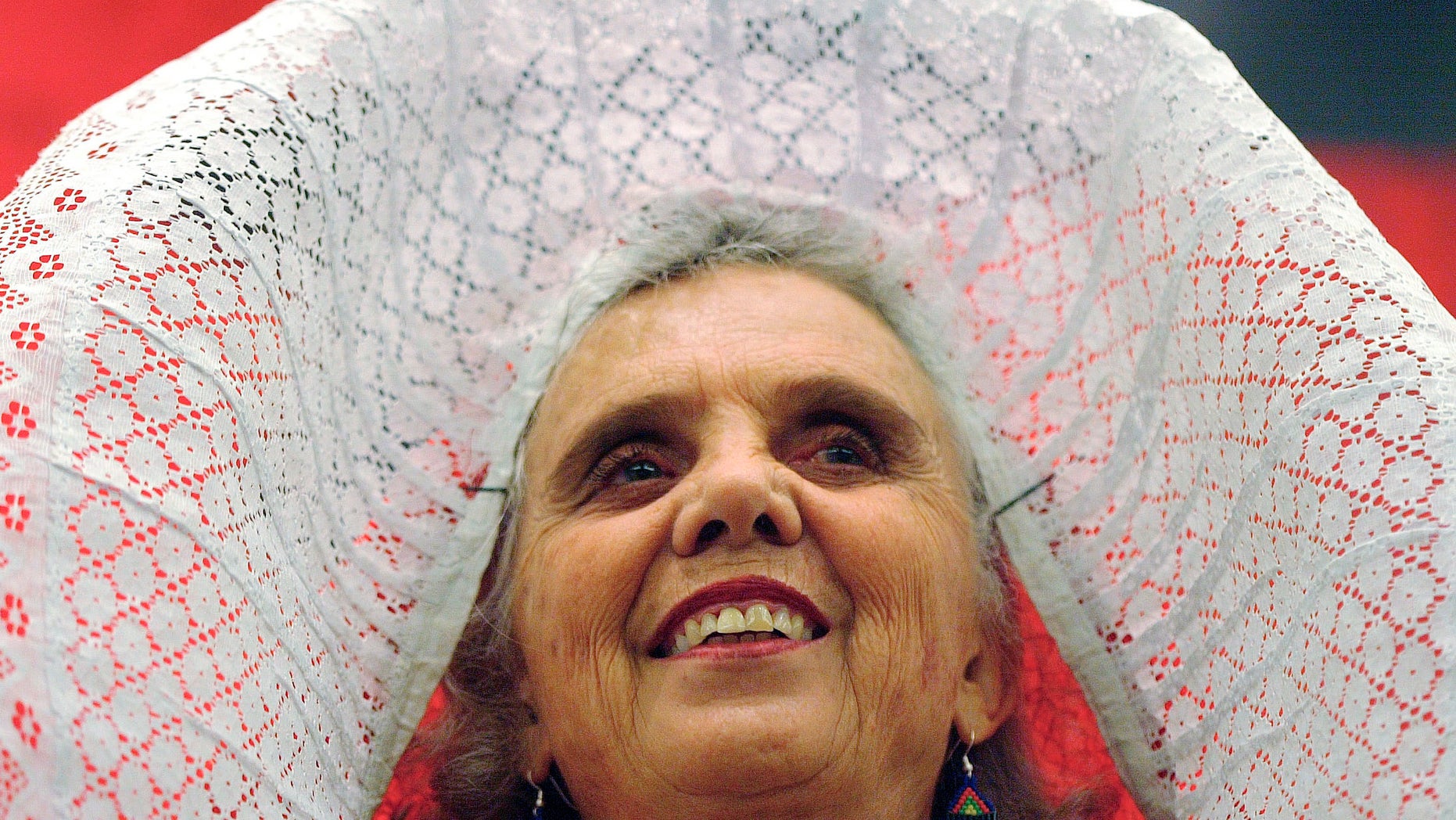FILE - In this Nov. 29 2005 file photo, Mexican author Elena Poniatowska, wearing a traditional tehuana outfit, smiles during the presentation of her new book "El Tren Paso Primero", "The Train Passed First", during the 19th Guadalajara International Book Fair in Guadalajara City, Mexico. Poniatowska has won the 2013 Cervantes Prize, the Spanish-speaking world's highest literary honor it was announced on Tuesday Nov. 19, 2013. The euro 125,000 prize generally alternates between Spanish and Latin American writers. Previous winners include Carlos Fuentes of Mexico, and Nobel prize winners Mario Vargas Llosa of Peru and Spain's late Camilo Jose Cela. They are presented each April 23, the anniversary of the death of Miguel de Cervantes, author of “Don Quijote.” (AP Photo/Guillermo Arias, File)