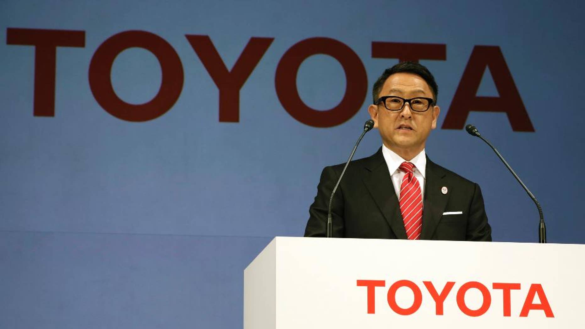 FILE- In this March 13, 2015, file photo, Toyota President and CEO Akio Toyoda speaks during a press conference in Tokyo. Toyota Motor Corp. stock is skidding in Tokyo trading after U.S. President-elect Donald Trump said Thursday, Jan. 5, 2017 on Twitter that the Japanese automaker faces a "big border tax" if it goes ahead with plans on a new Mexico plant. (AP Photo/Eugene Hoshiko, File)