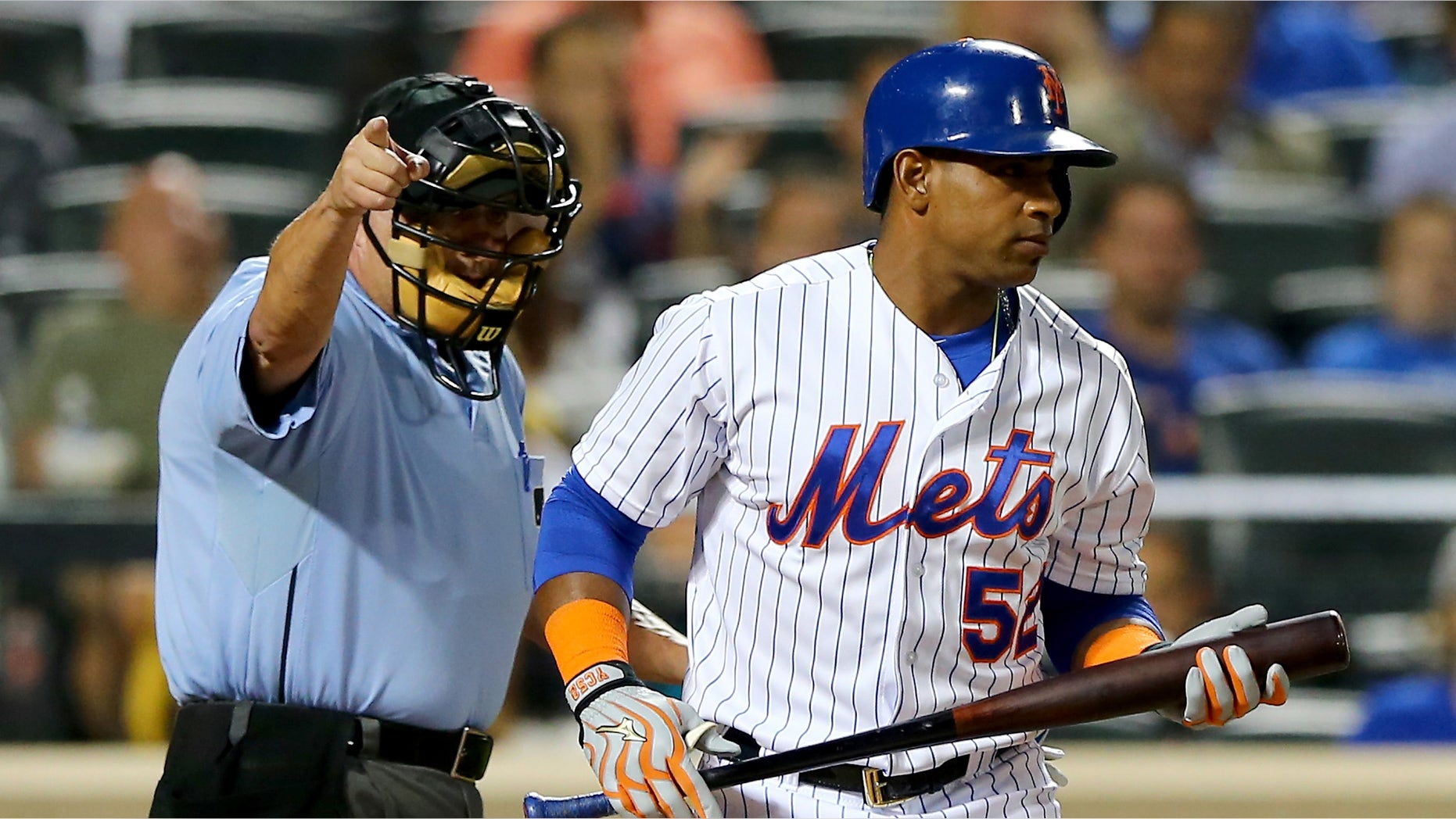 NEW YORK, NY - SEPTEMBER 15: Home plate umpire Dale Scott sends Yoenis Cespedes #52 of the New York Mets to first after he is hit by a pitch from Tom Koehler #34 of the Miami Marlins in the first inning on September 15, 2015 at Citi Field in the Flushing neighborhood of the Queens borough of New York City. (Photo by Elsa/Getty Images)