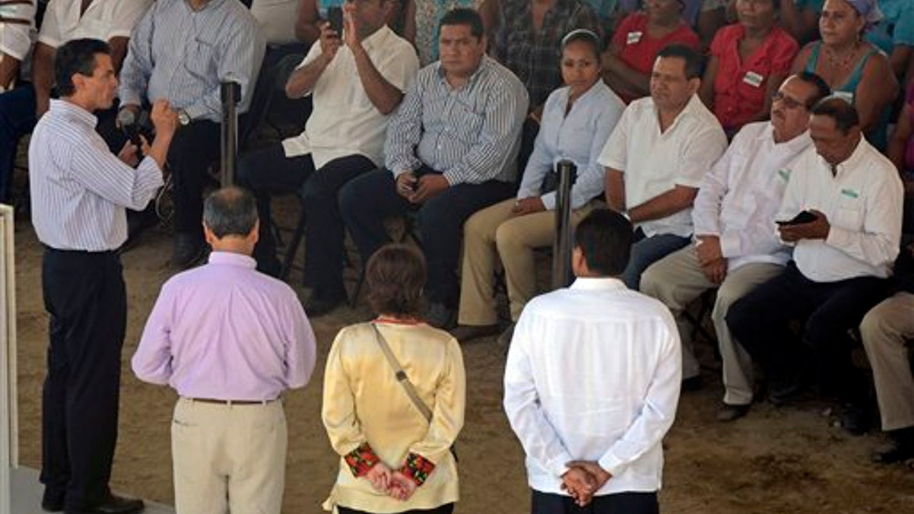 Mexico's President Enrique Peña Nieto speaks to the audience in Coyuca de Benitez in the state of Guerrero, on Dec. 4, 2014.
