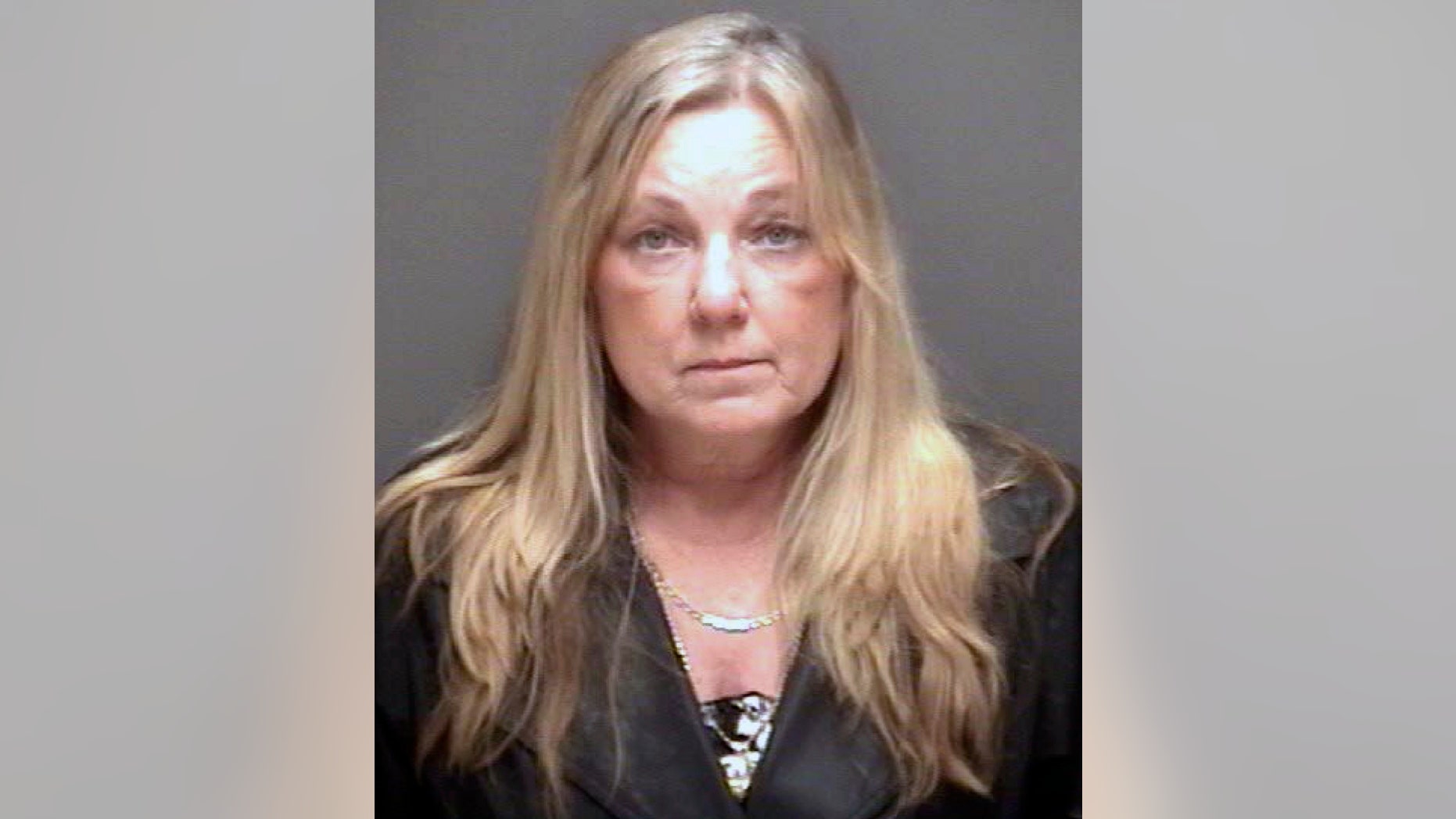 This undated booking photo provided by the Santa Fe Police Department shows 55-year-old Deborah Tagle.