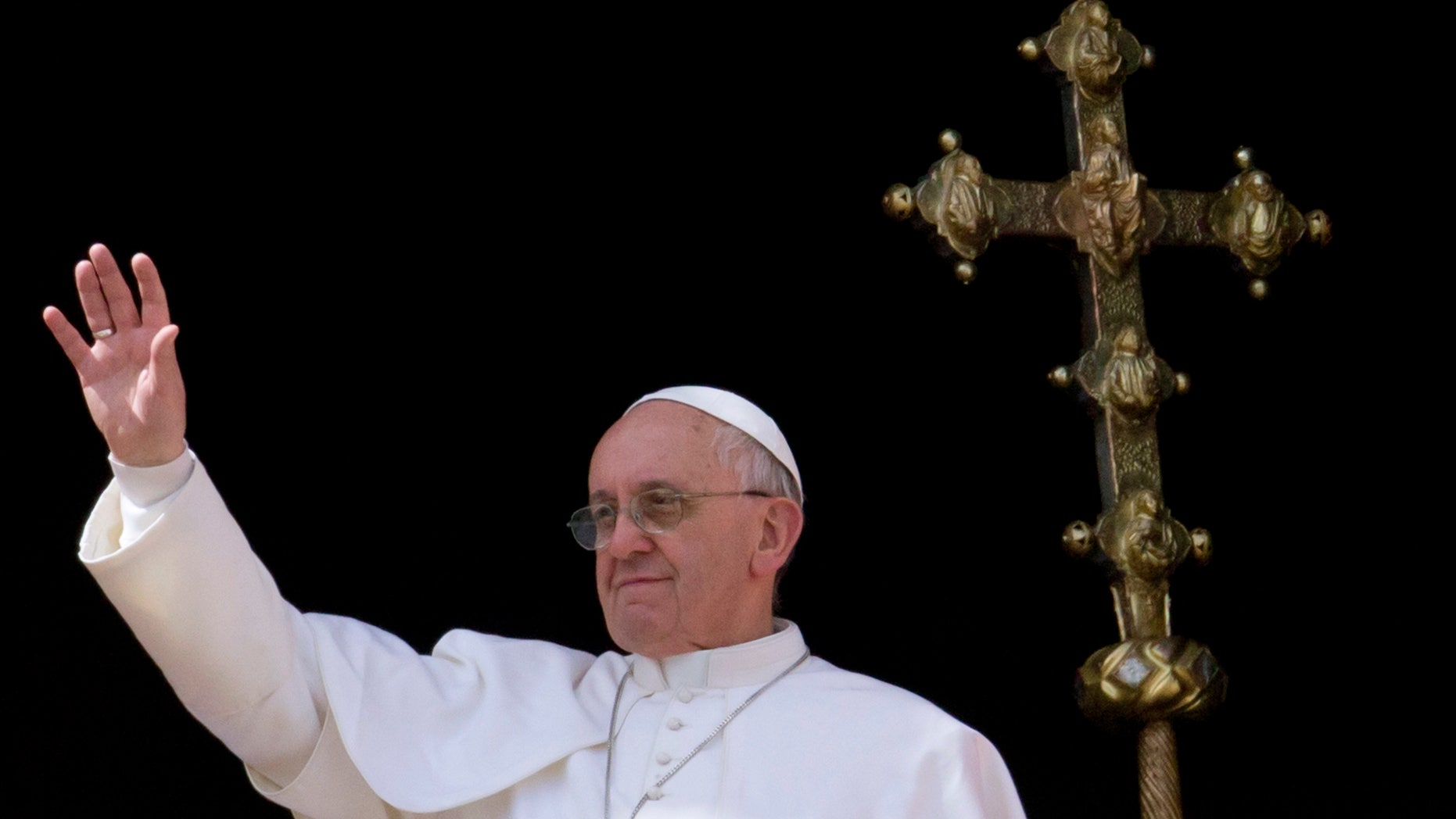 FILE - In this Sunday, March 31, 2013 photo, Pope Francis greets the faithful at the end of the Easter Mass in St. Peter's Square at the Vatican. Francis is the first Jesuit to be elected pope, and members of the order have only started absorbing the novelty of one of their own leading the church. But they have also started thinking ahead, to the potential impact of this pontificate on their many ministries, colleges and overall future. (AP Photo/Andrew Medichini, File)