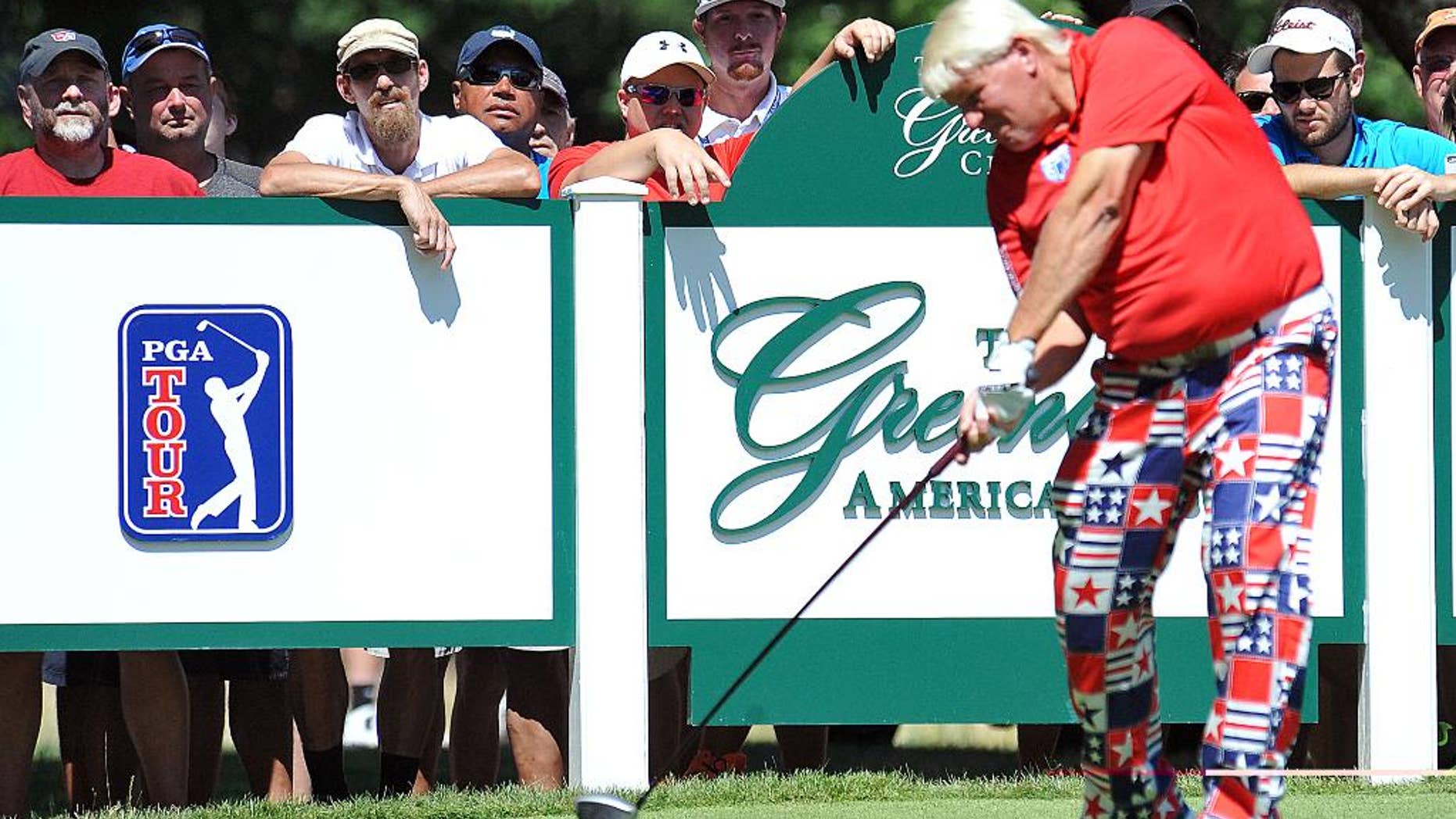 John Daly tees off on the eighth hole during the second round of the Greenbrier Classic golf tournament at the Greenbrier Resort in White Sulphur Springs, W.Va., Friday, July 4, 2014. (AP Photo/Chris Tilley)