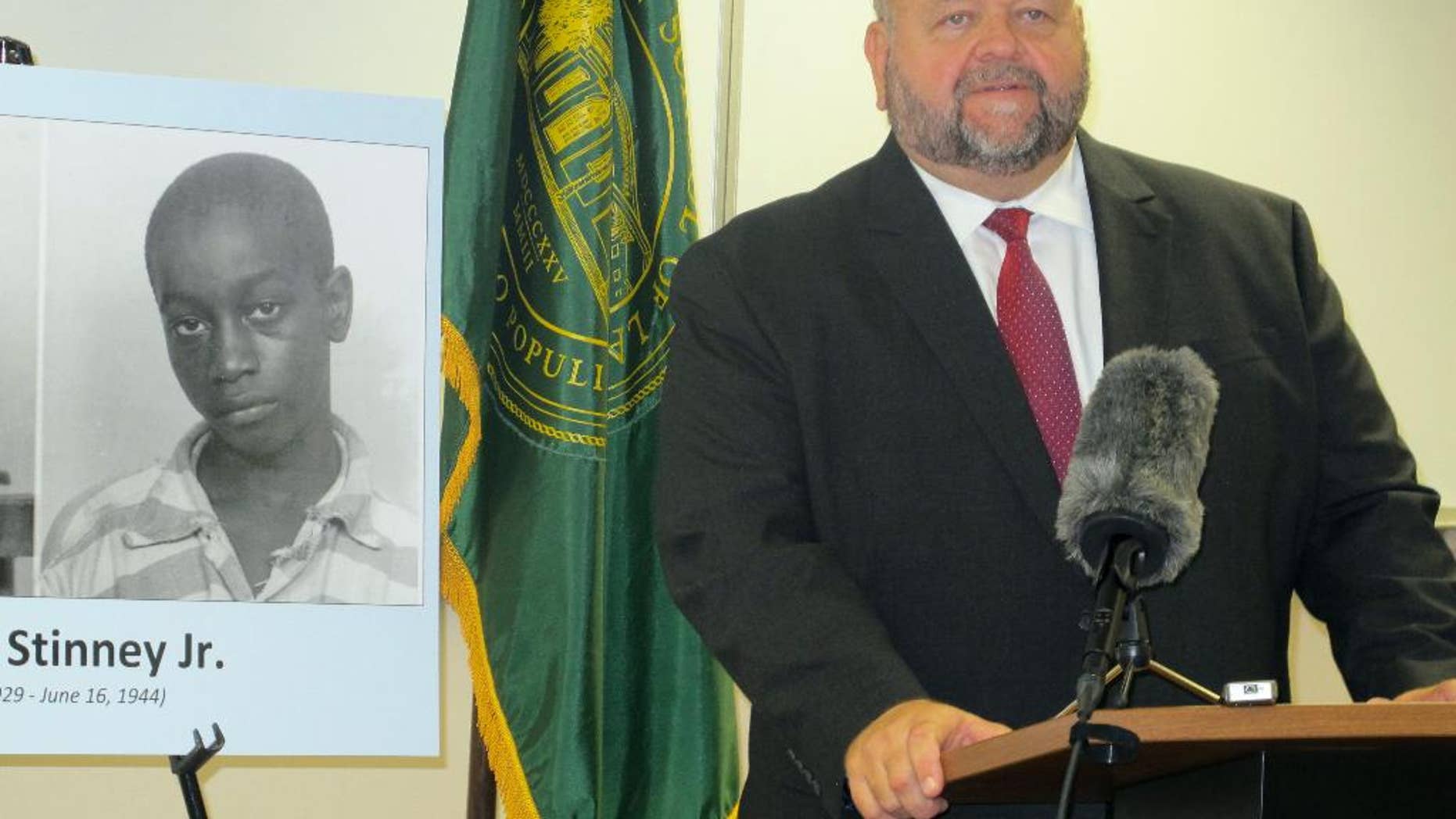 Miller Shealy, a professor at the Charleston School of Law, announces at the school in Charleston, S.C., on Friday, Aug. 26, 2016, that attorneys plan to bring a civil rights lawsuit stemming from the 1944 execution of George Stinney. Stinney, executed in Columbia, S.C., was one of the youngest defendants executed in American history and the youngest executed in the 20th century. An all-white jury took only 10 minutes to decide Stinney's fate in the summer of 1944. A South Carolina state judge vacated the conviction almost two years ago. Attorneys announced Friday they will be working with law school students to file a lawsuit on behalf of Stinney's family. (AP Photo/Bruce Smith)