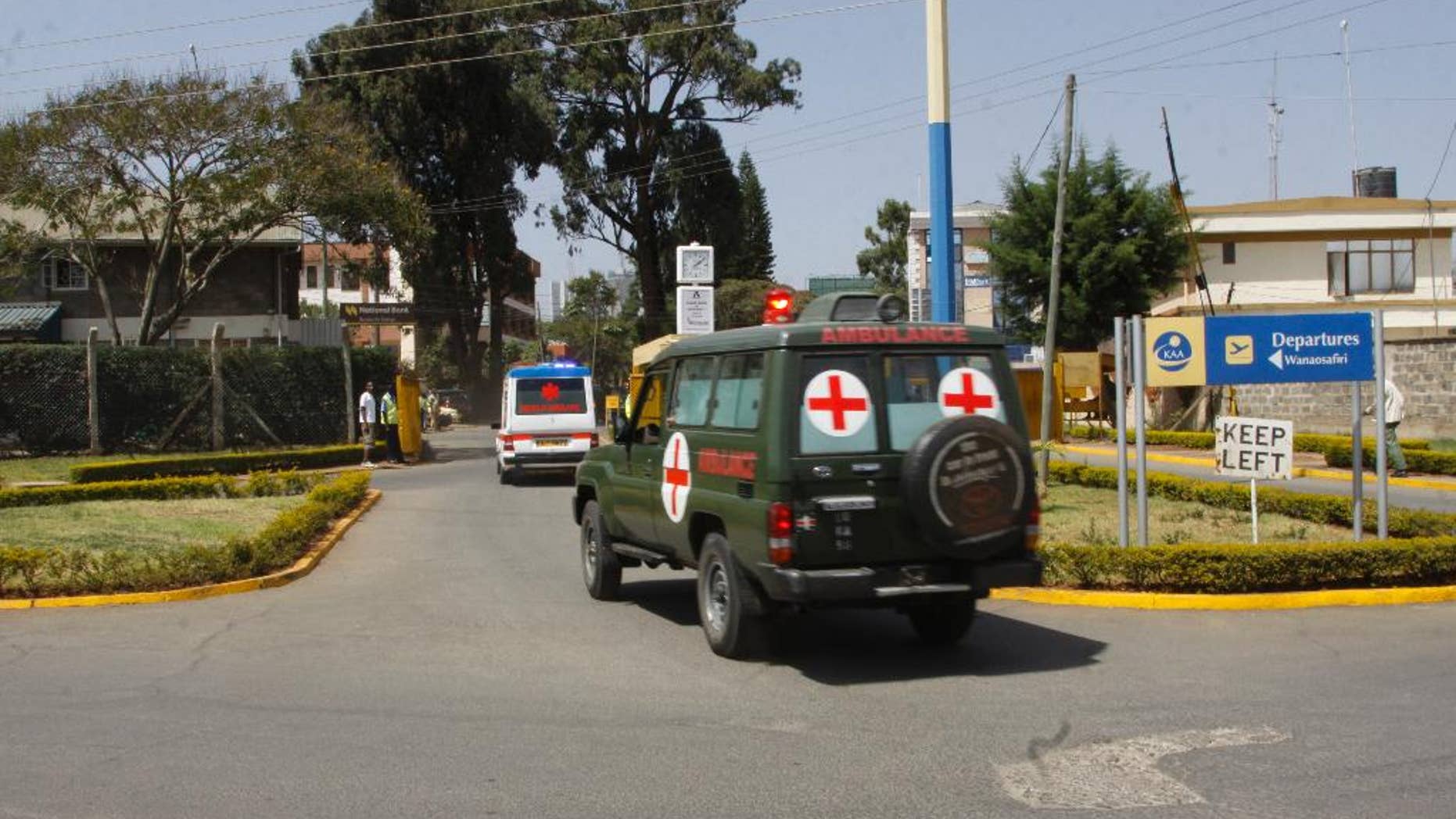Bodies of Kenyan soldiers are transported by ambulances as they arrive at Wilson airport, Nairobi Kenya, Friday Jan 27, 2017. A spokesman for extremist group al-Shabab says its fighters have killed at least 51 Kenyan soldiers in an attack on an army base in Kulbiyow, a town in Lower Jubba region. (AP Photo/Khalil Senosi)