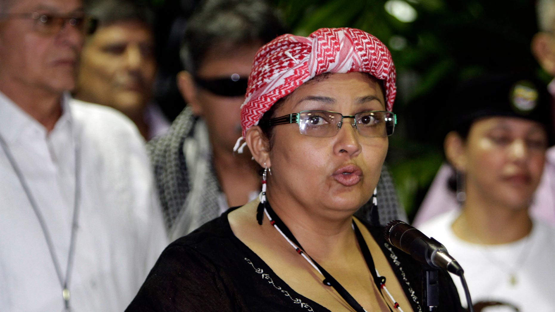 Victoria Sandino, member of the Revolutionary Armed Forces of Colombia, FARC, speaks to reporters during peace talks with Colombia's government in Havana, Cuba, Thursday, April. 25, 2013. FARC leaders thanked U.S. lawmakers on Thursday, April 25, 2013 for supporting the peace process between them and the Colombian government in Cuba in a letter sent to State Secretary John Kerry. (AP Photo/Ismael Francisco, Cubadebate)