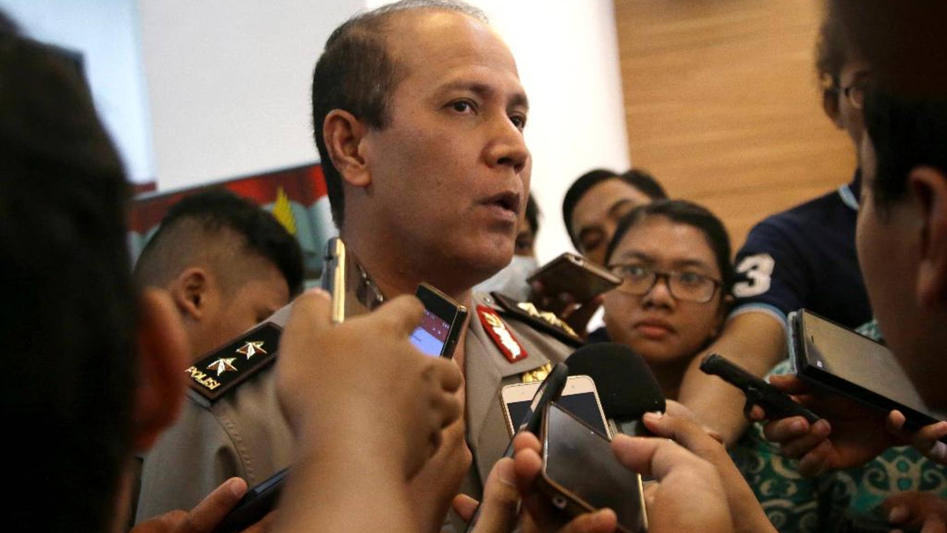 Indonesian National Police spokesman Maj. Gen. Boy Rafli Amar speaks to the media after a press conference at the National Police headquarters in Jakarta, Indonesia, Tuesday, July 19, 2016. Two suspected militants were killed Monday in the shootout in a remote jungle area of Sulawesi where security forces have been pursuing the country's most wanted Islamic militant Santoso and his followers for months. (AP Photo/Tatan Syuflana)