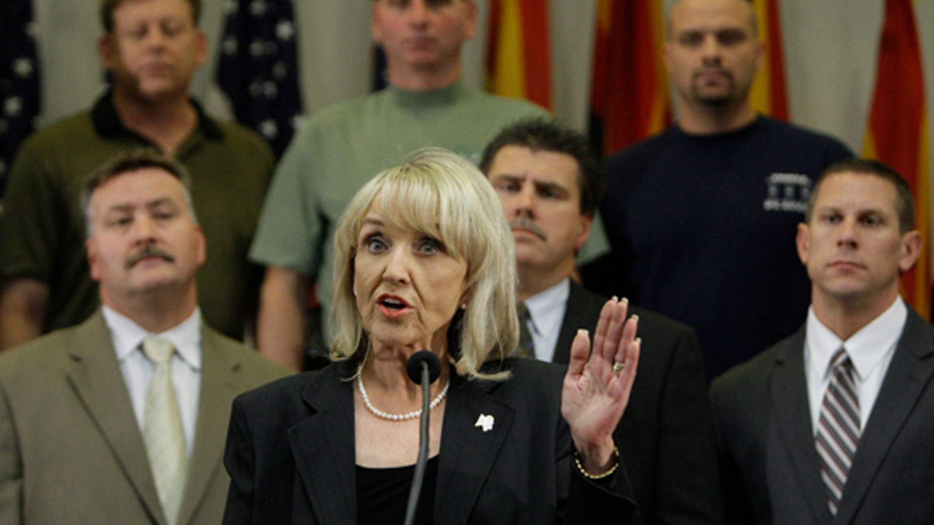 FILE: In this Apr. 23, 2010, photo, Arizona Gov. Jan Brewer talks about signing the immigration bill that is now the subject of a potential Supreme Court appeal.