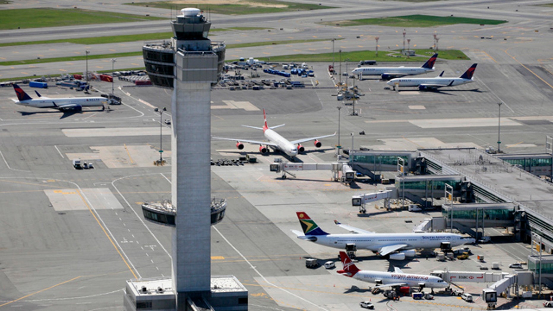 FILE: April 2010: The air traffic control tower and terminals at John F. Kennedy International Airport in New York.