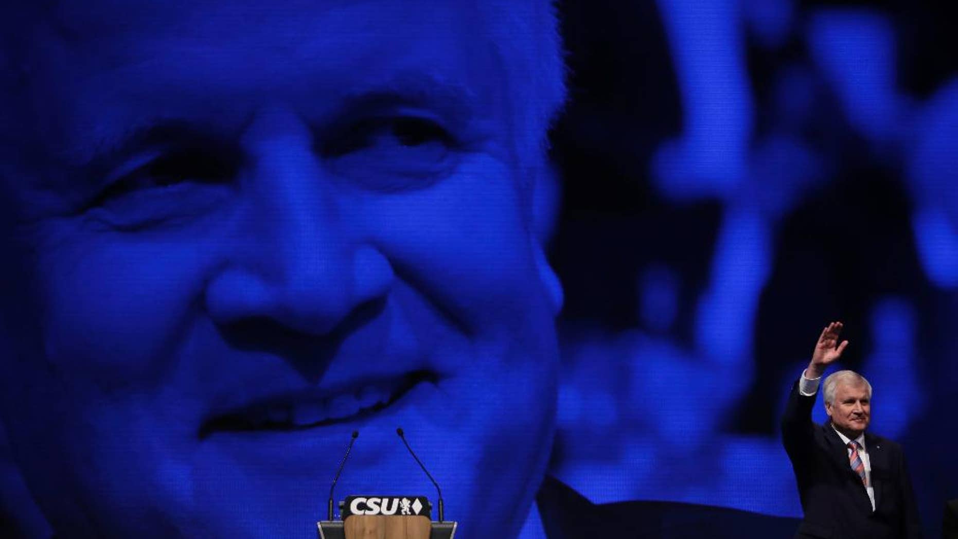 Bavarian State Governor and Chairman of German Christian Social Union party, CSU, Horst Seehofer, waves after his speech at a party convention of the German Christian Social Union, CSU, in Munich, Germany, Friday, Nov. 4, 2016. (AP Photo/Matthias Schrader)