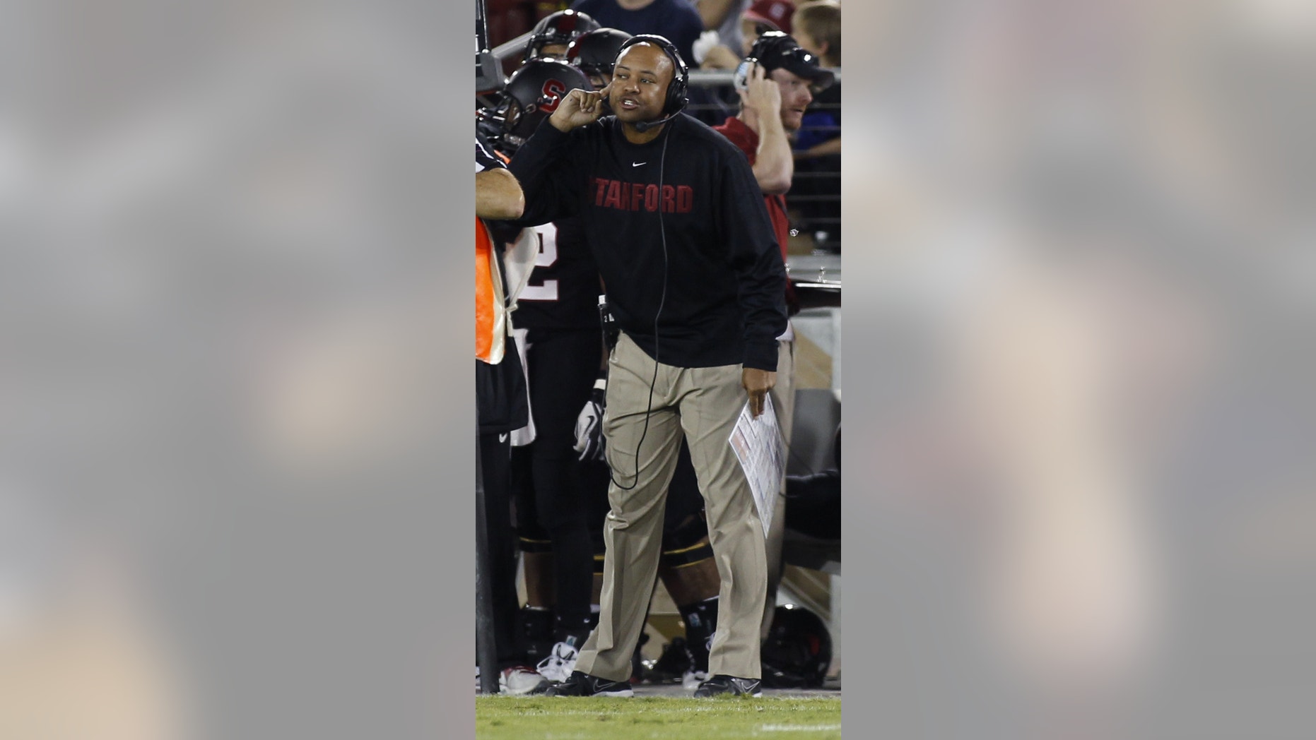 Stanford head coach David Shaw gestures during the first half of an NCAA college football game against Washington in Stanford, Calif., Saturday, Oct. 5, 2013. (AP Photo/George Nikitin)