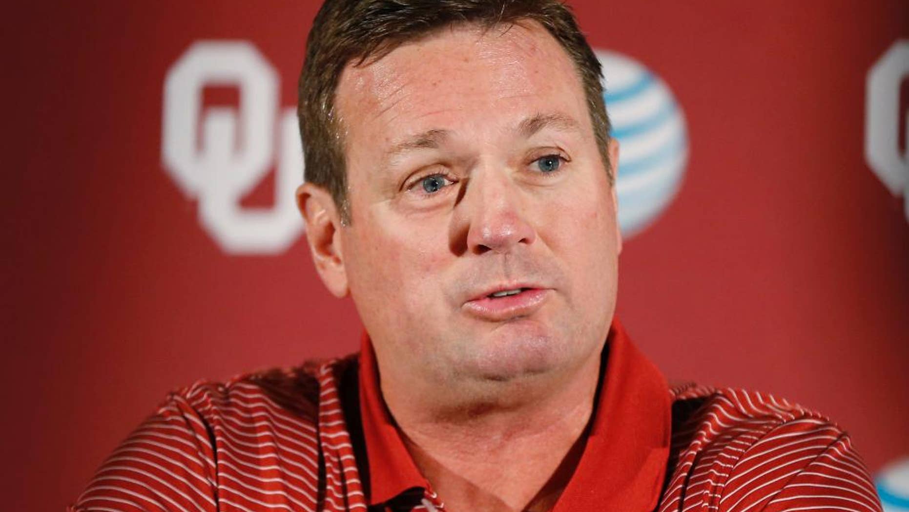 Oklahoma head coach Bob Stoops answers a question during a news conference in Norman, Okla., Monday, Aug. 25, 2014. Some uncertainties have cleared up as No. 4 Oklahoma prepares to open the season Saturday against Louisiana Tech. (AP Photo/Sue Ogrocki)