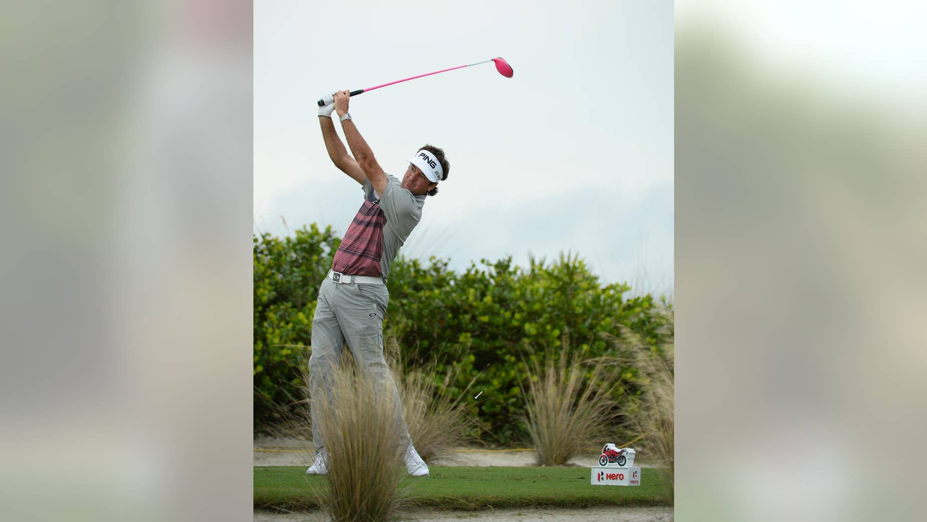 In this photo provided by the Tiger Woods Foundation, Bubba Watson tees off on the 11th hole at Albany Golf Club during the Hero World Challenge in Nassau, Bahamas on Sunday, Dec. 6, 2015. Watson won the tournament by three shots. (J.D. Cuban/Tiger Woods Foundation via AP)