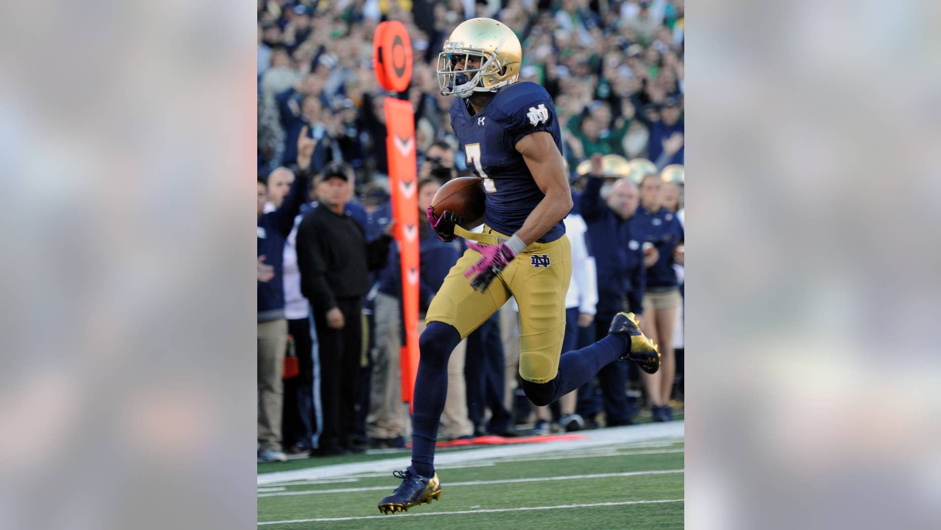 Notre Dame wide receiver Will Fuller heads towards the endzone for a touchdown in the second half of an NCAA college football game against North Carolina, Saturday, Oct. 11, 2014, in South Bend, Ind. (AP Photo/Joe Raymond)