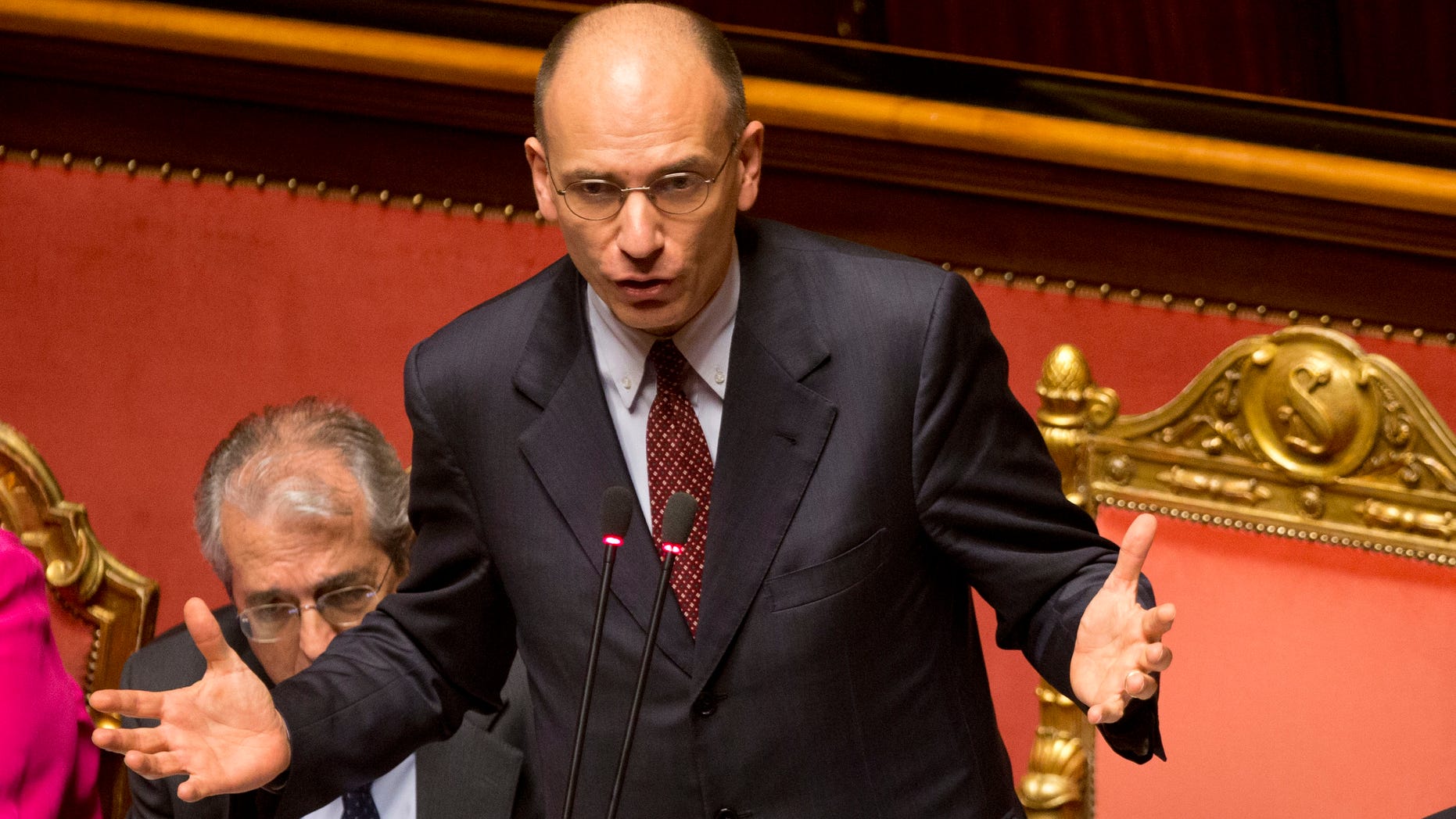 Italian Premier Enrico Letta delivers his speech ahead of a second confidence vote to confirm the government, in the Italian Senate in Rome, Tuesday, April 30, 2013. Italy's new government easily passed its first confirmation vote Monday in Parliament after Premier Enrico Letta made concessions to his uneasy coalition allies, promising to ease part of a slate of austerity measures that have weighed on Italians impatient at the slow pace of economic recovery. (AP Photo/Alessandra Tarantino)