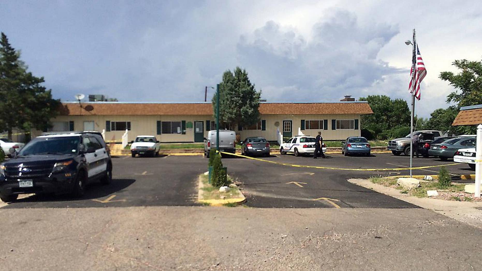 This photo released on Aug. 8, 2016, by the Pueblo Police Department, shows an exterior of Pueblo Grande Village, a mobile home park which was the site a of triple downing on Aug. 8, 2016, north of Pueblo, southern Colorado. Two sisters, ages three and five, and their 17-year-old female baby sitter drowned in a swimming pool in the mobile home park, police said Monday. (Pueblo Police Department via AP)