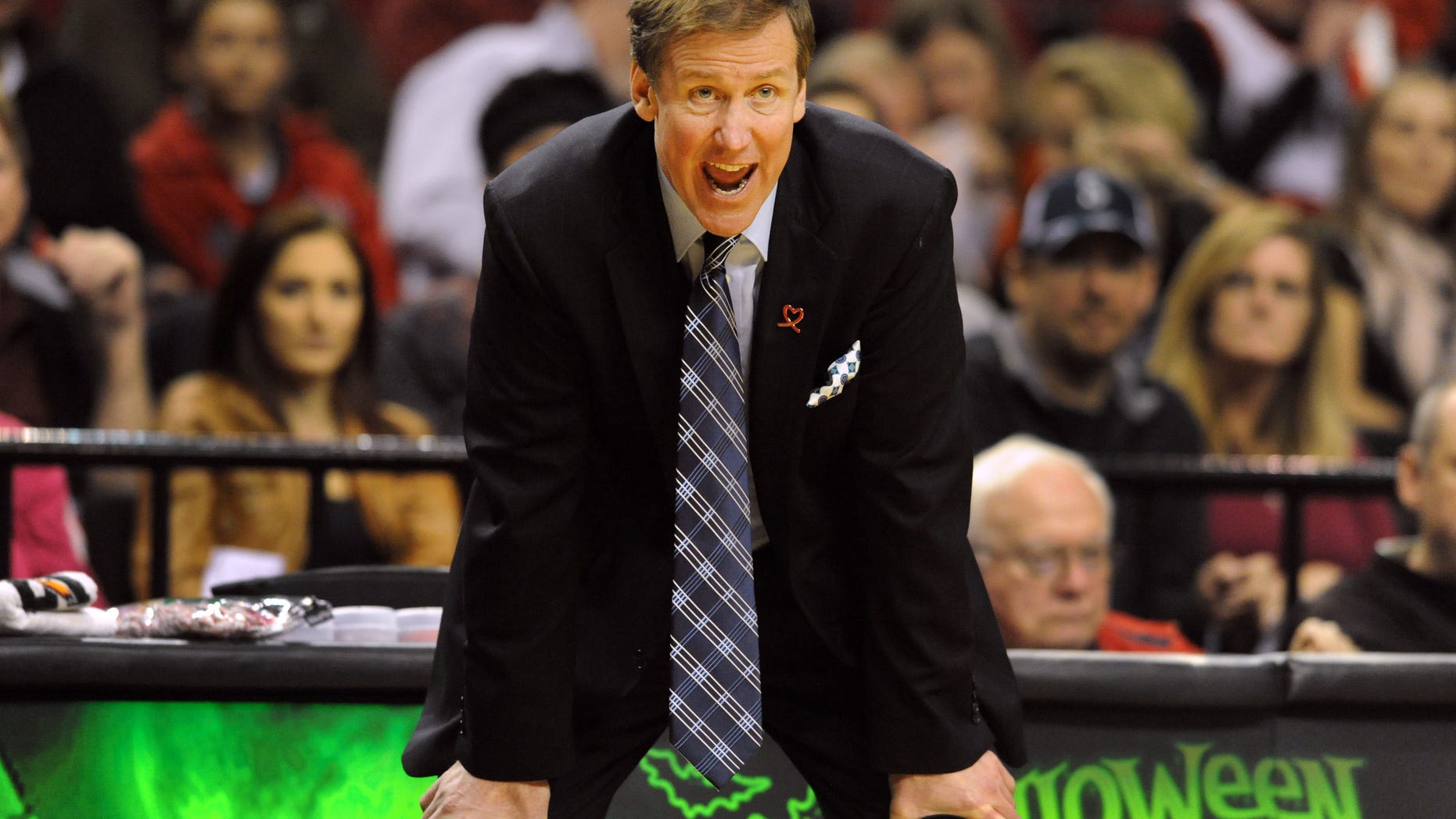 Portland Trail Blazers head coach Terry Stotts yells out to his team during the second half of an NBA basketball game against the Sacramento Kings on Sunday, October 20, 2013, in Portland. Portland won 109-105. (AP Photo/Steve Dykes)