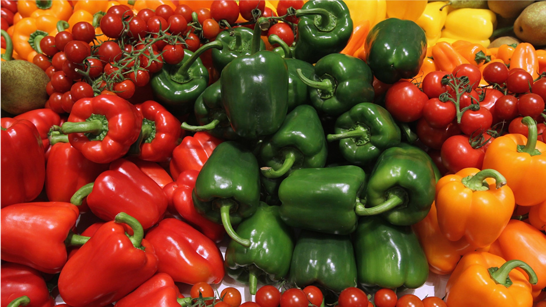 BERLIN, GERMANY - JANUARY 21: Fresh vegetables, including tomatoes and bell peppers, lie on display at the Netherlands hall at the 2011 Gruene Woche agricultural trade fair at Messe Berlin on January 21, 2011 in Berlin, Germany. The trade fair comes on the heels of a dioxon scandal in Germany that led to the recent quarantine of approximately 6,000 farms. (Photo by Sean Gallup/Getty Images)