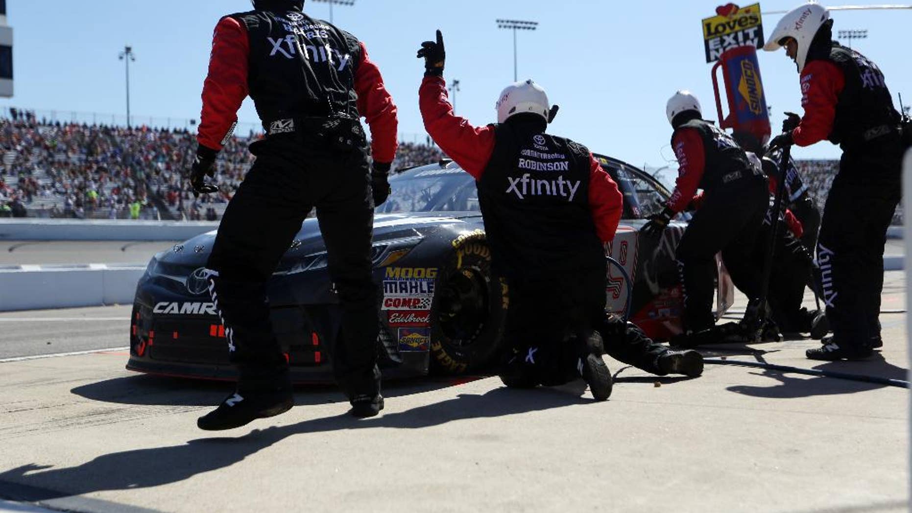 Carl Edwards comes in for a pit stop during the Sprint Cup auto race at Richmond International Raceway in Richmond, Va., Sunday, April 24, 2016. (AP Photo/Chet Strange)