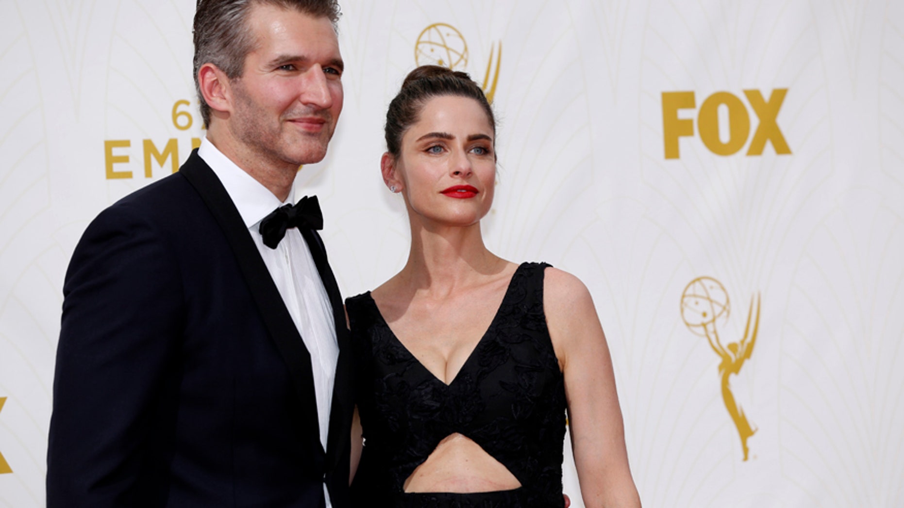 Writer David Benioff and wife, actress Amanda Peet, arrive at the 67th Primetime Emmy Awards in Los Angeles, California September 20, 2015.