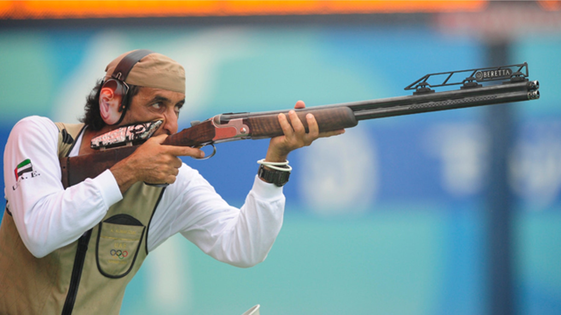 Ahmed Almaktoum of UAE shoots during the qualifying round of the men's trap competition at the Beijing 2008 Olympic Games August 10, 2008.