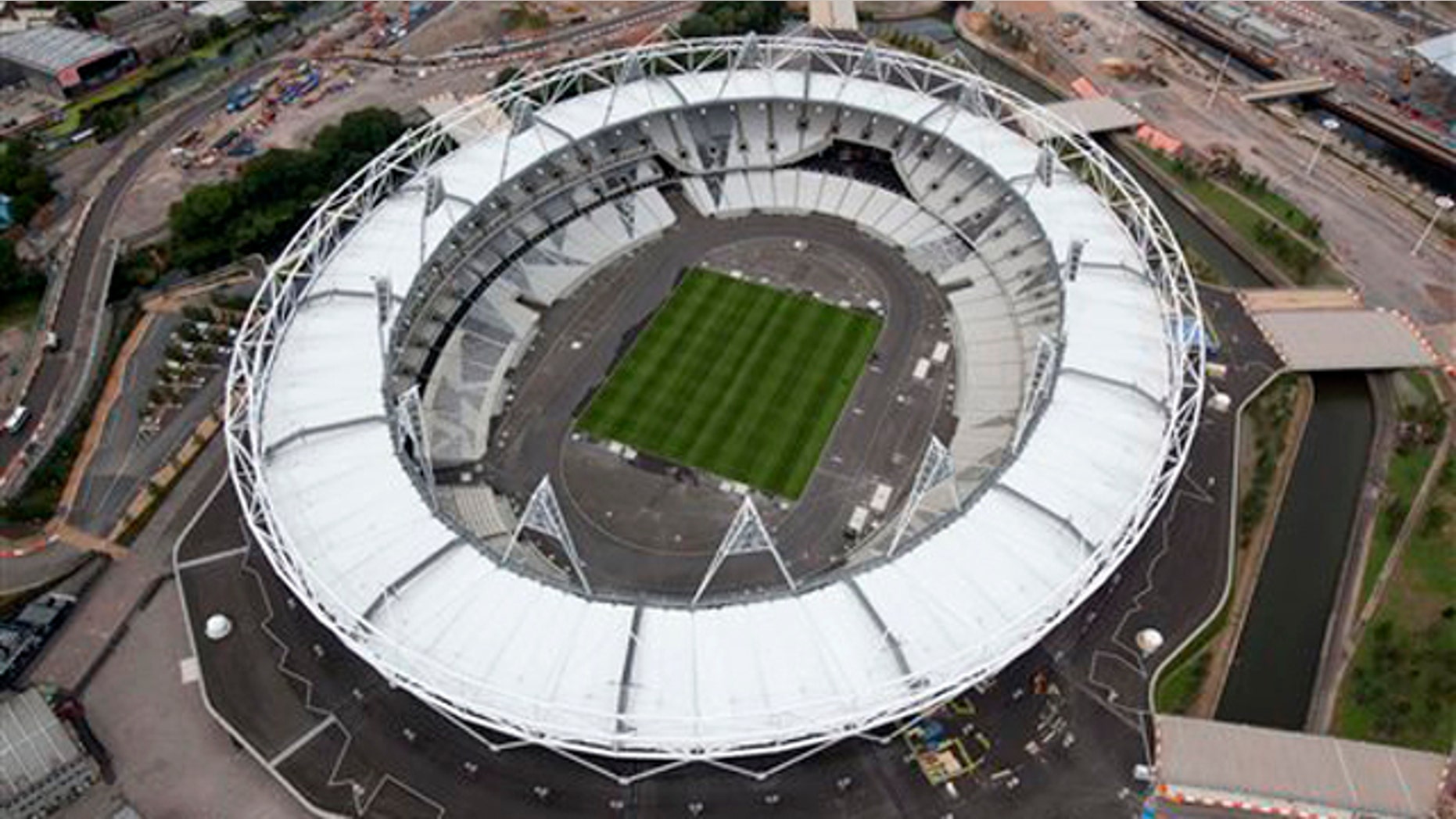 In this photo taken July 14, 2011 and made available by the Olympic Delivery Authority, an aerial view of the Olympic stadium is seen at the Olympic Park, London. With exactly a year to go until the start of the London 2012 Games, the Olympic Delivery Authority, ODA, has announced that the Aquatics Center is now complete, the last of the six main permanent Olympic Park venues to finish construction. (AP Photo/Olympic Delivery Authority, Anthony Charlton) EDITORIAL USE ONLY