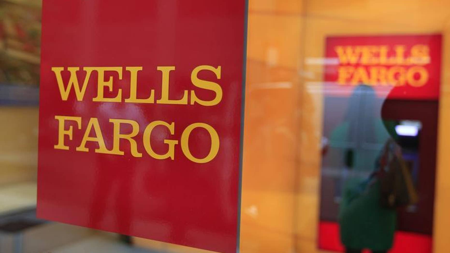 A Wells Fargo sign is seen outside a banking branch in New York July 13, 2012. REUTERS/Shannon Stapleton