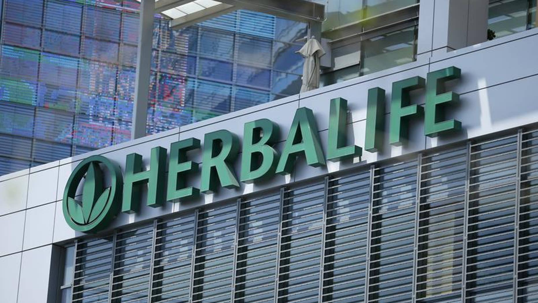 The Herbalife logo is seen on a building housing some of their offices in downtown Los Angeles, California April 28, 2013. REUTERS/Lucy Nicholson