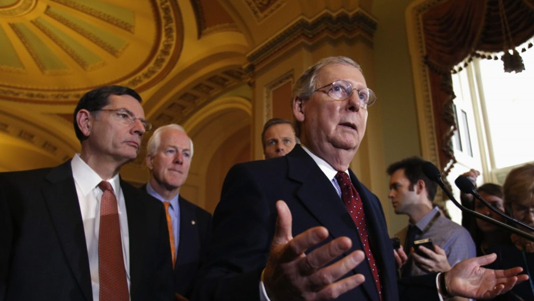U.S. Senate Minority Leader Mitch McConnell (R-KY) speaks to the media following a Senate cloture vote on budget bill on Capitol Hill in Washington December 17, 2013. REUTERS/Yuri Gripas