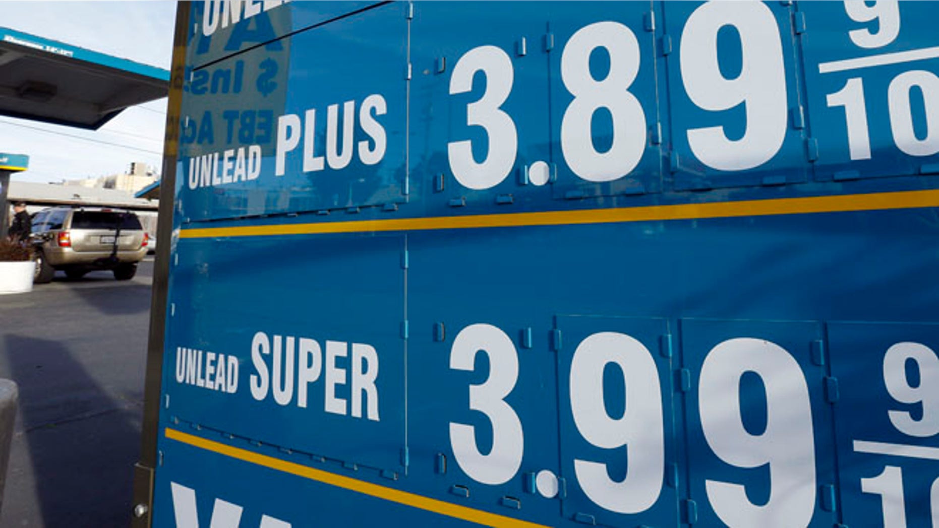Gasoline prices are displayed as a motorist refuels his vehicle Friday, Feb. 1, 2013, in Oakland, Calif. The nationwide average price for a gallon of gas jumped 4 cents overnight to $3.46 a gallon, according to AAA. That makes a three-day gain of 10 cents and, for the first time in 2013, gas now costs more than it did a year ago. (AP Photo/Ben Margot)