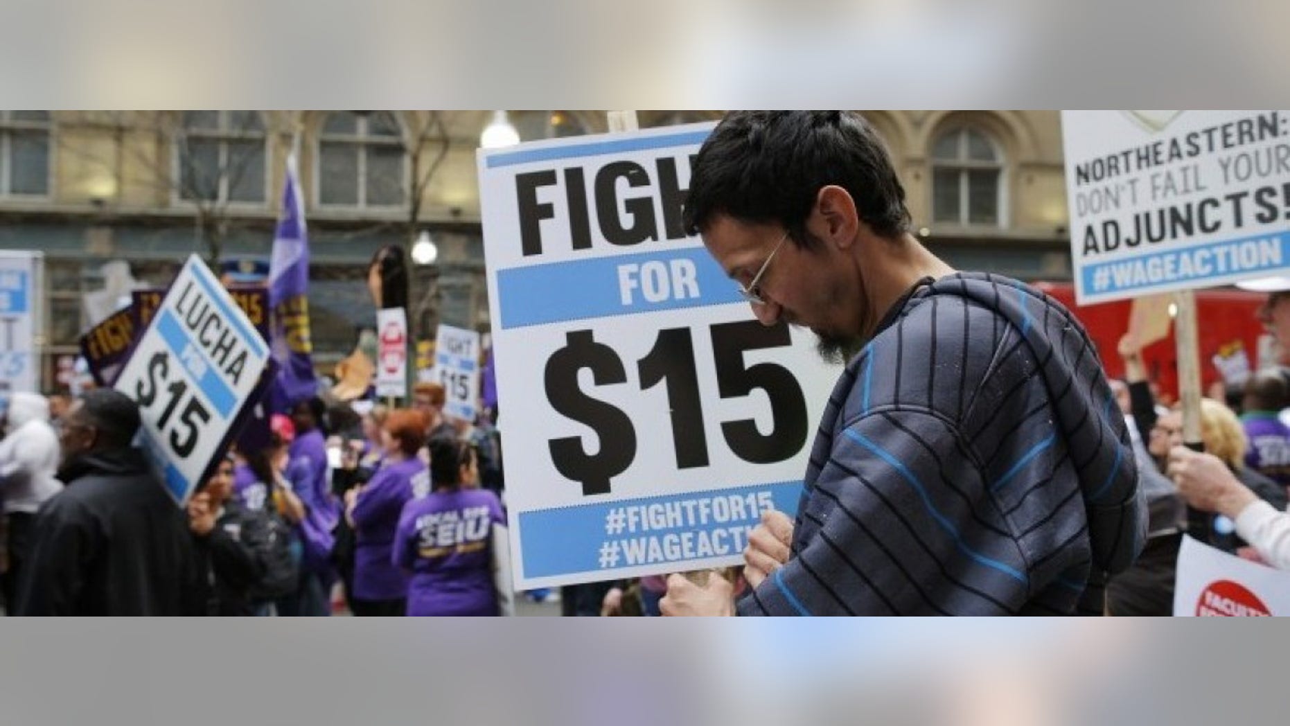 David Coulombe participates in a march and rally for $15 minimum wage in Boston, Massachusetts April 14, 2015. REUTERS/Brian Snyder
