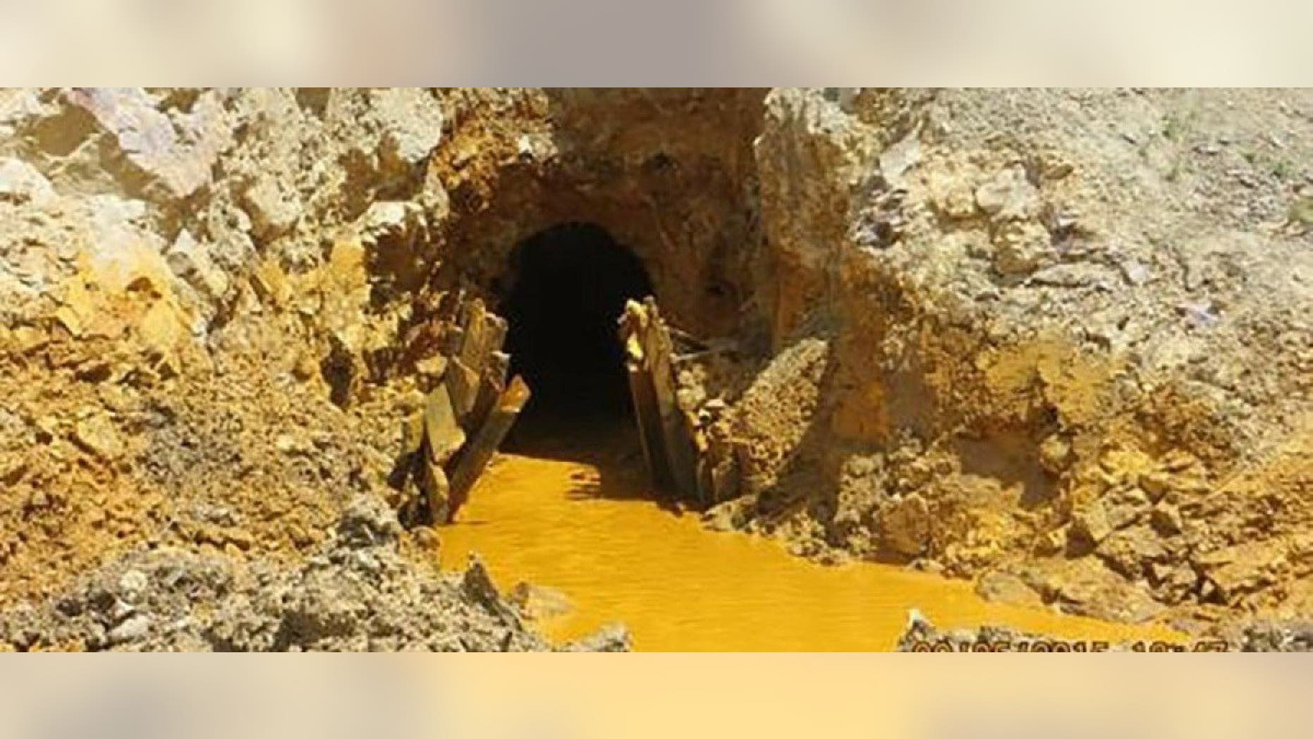 Yellow mine waste water is seen at the entrance to the Gold King Mine in San Juan County, Colorado, in this picture released by the Environmental Protection Agency (EPA) taken August 5, 2015. REUTERS/EPA/Handout