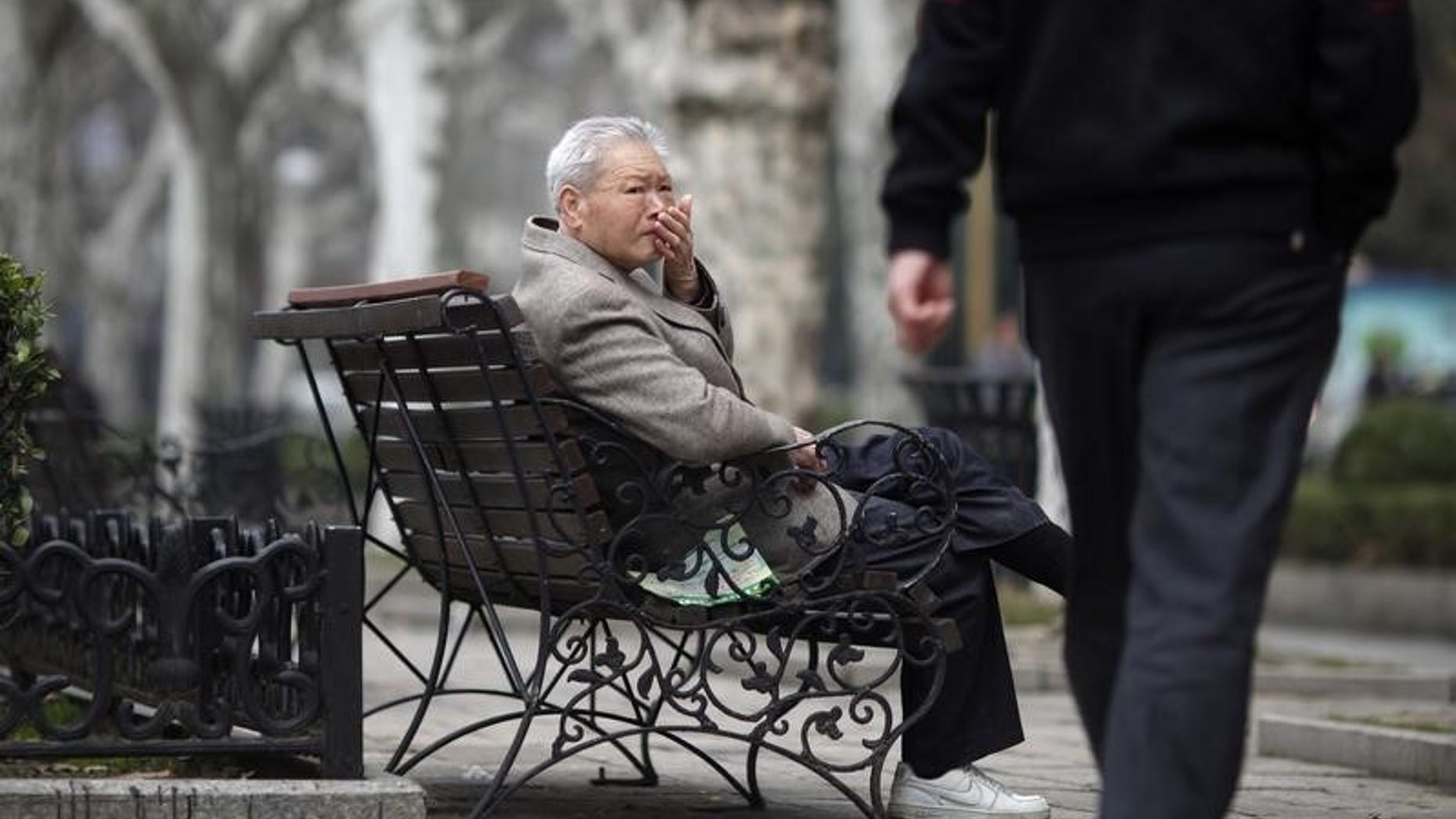 An elderly man sits at a park in Shanghai March 16, 2012. REUTERS/Carlos Barria