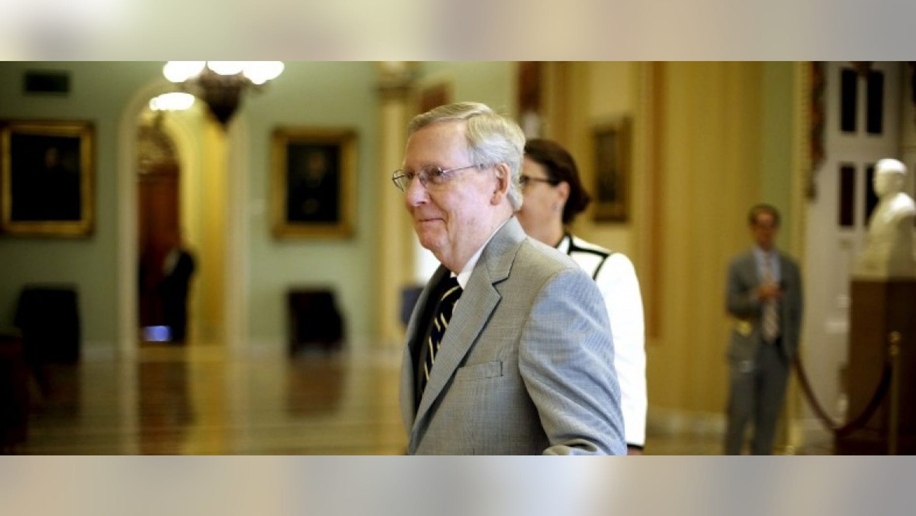 U.S. Senate Majority Leader Mitch McConnell (R-KY) gives a wave to staff members as he walks to the senate floor at the U.S. Capitol in Washington September 8, 2015. REUTERS/Jonathan Ernst