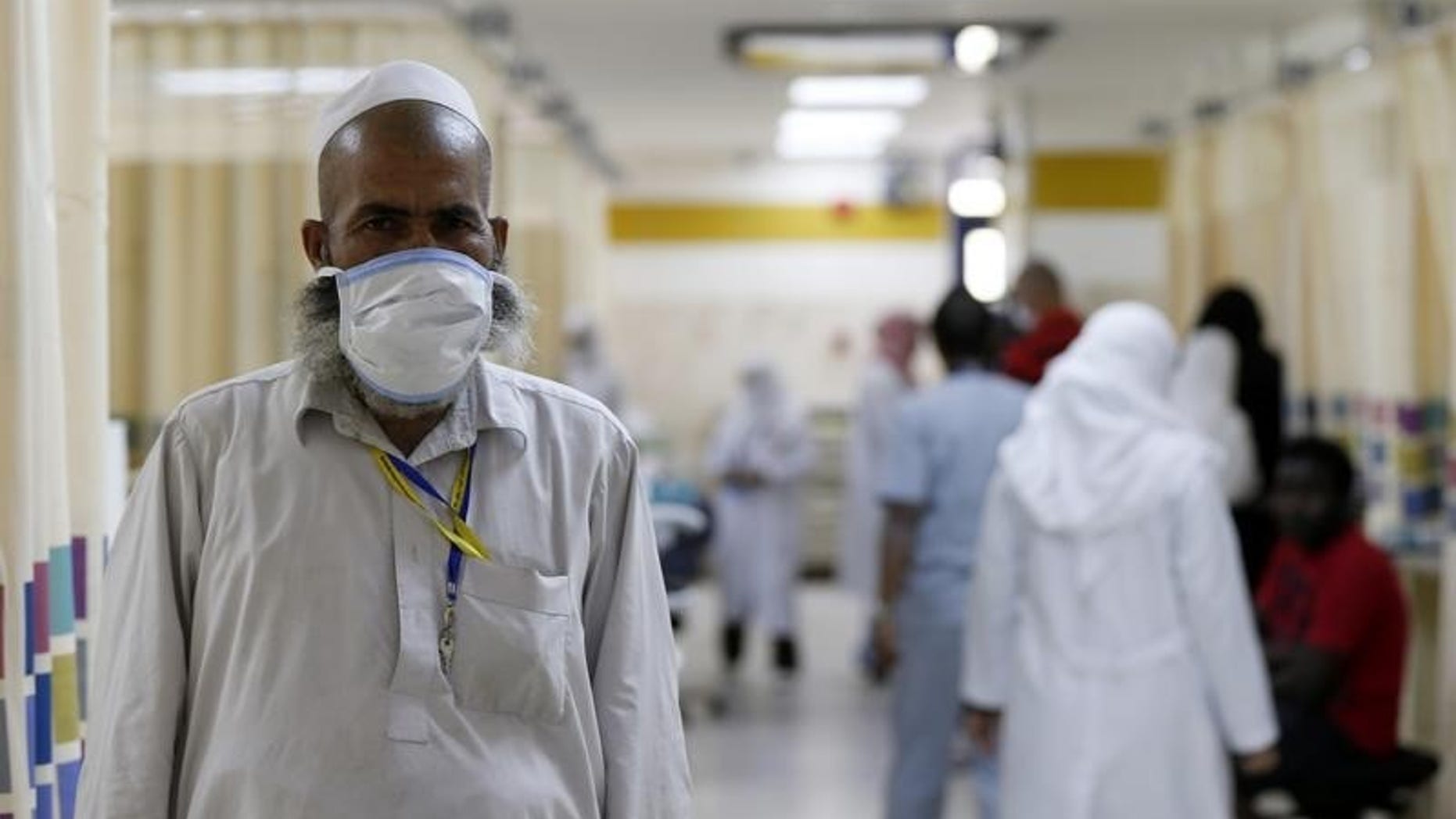 A Muslim pilgrim wears a protective mask in the emergency department at Al-Noor Specialist Hospital in Mecca September 30, 2014. REUTERS/ Muhammad hamed