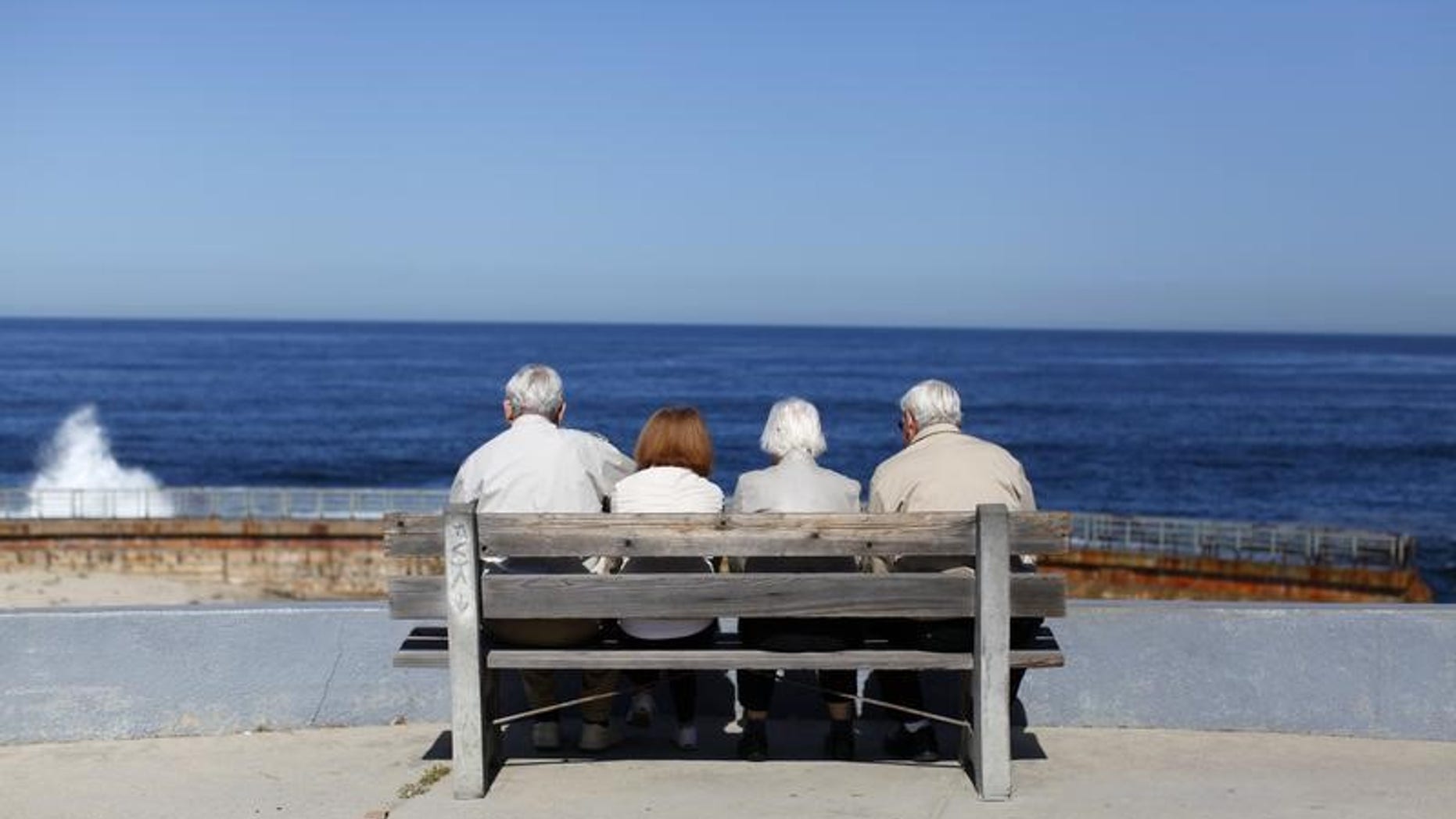 A pair of elderly couples view the ocean and waves along the beach in La Jolla, California March 8, 2012. REUTERS/Mike Blake