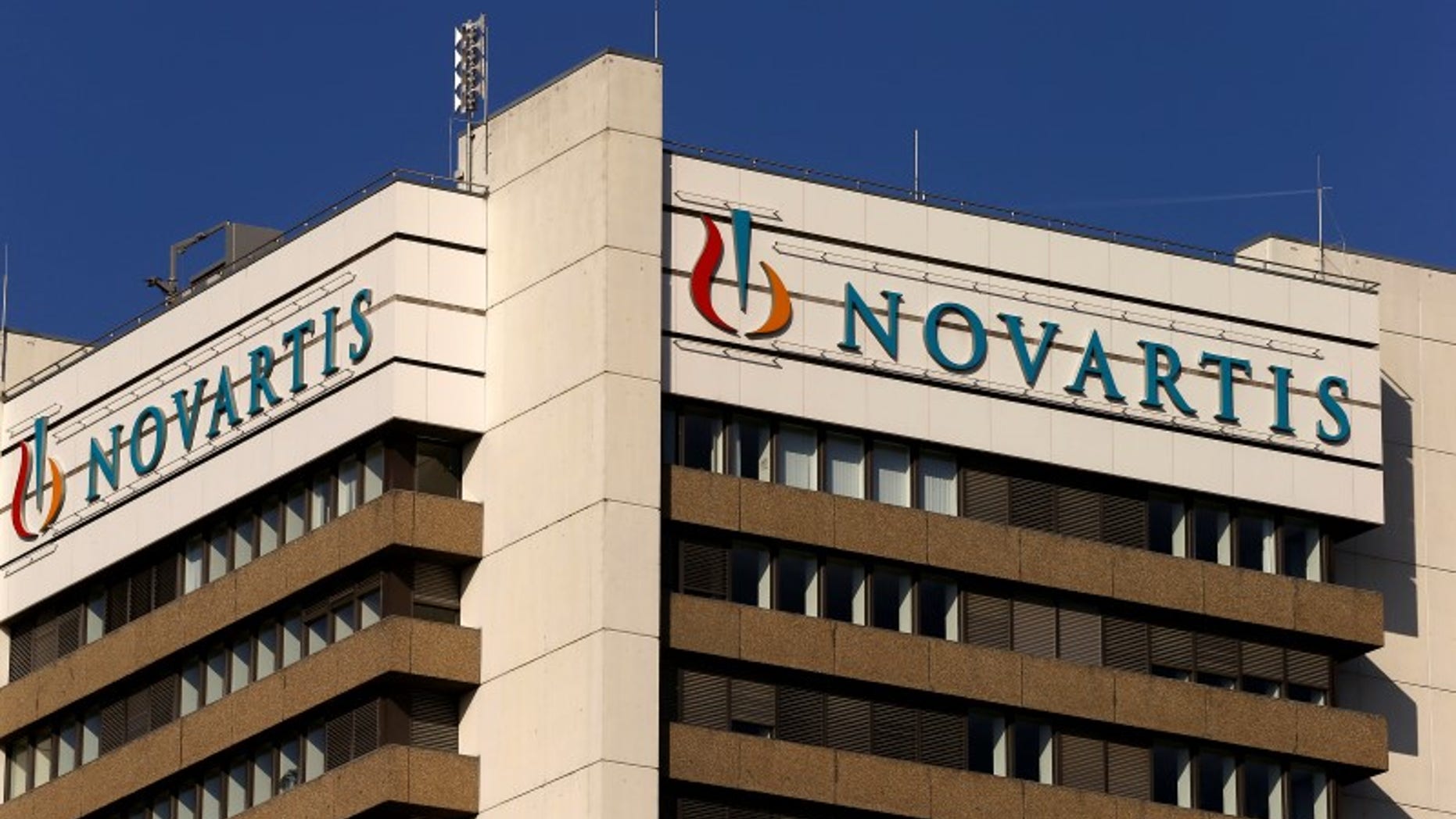 The logo of Swiss pharmaceutical company Novartis is seen on its headquarters building in Basel, Switzerland October 27, 2015. REUTERS/Arnd Wiegmann