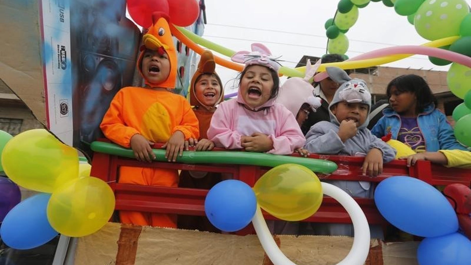Preschool children dressed as animals participate in a parade ahead of preschool education celebration day, at the district of Villa El Salvador on the outskirts of Lima, May 23, 2014. REUTERS/Mariana Bazo