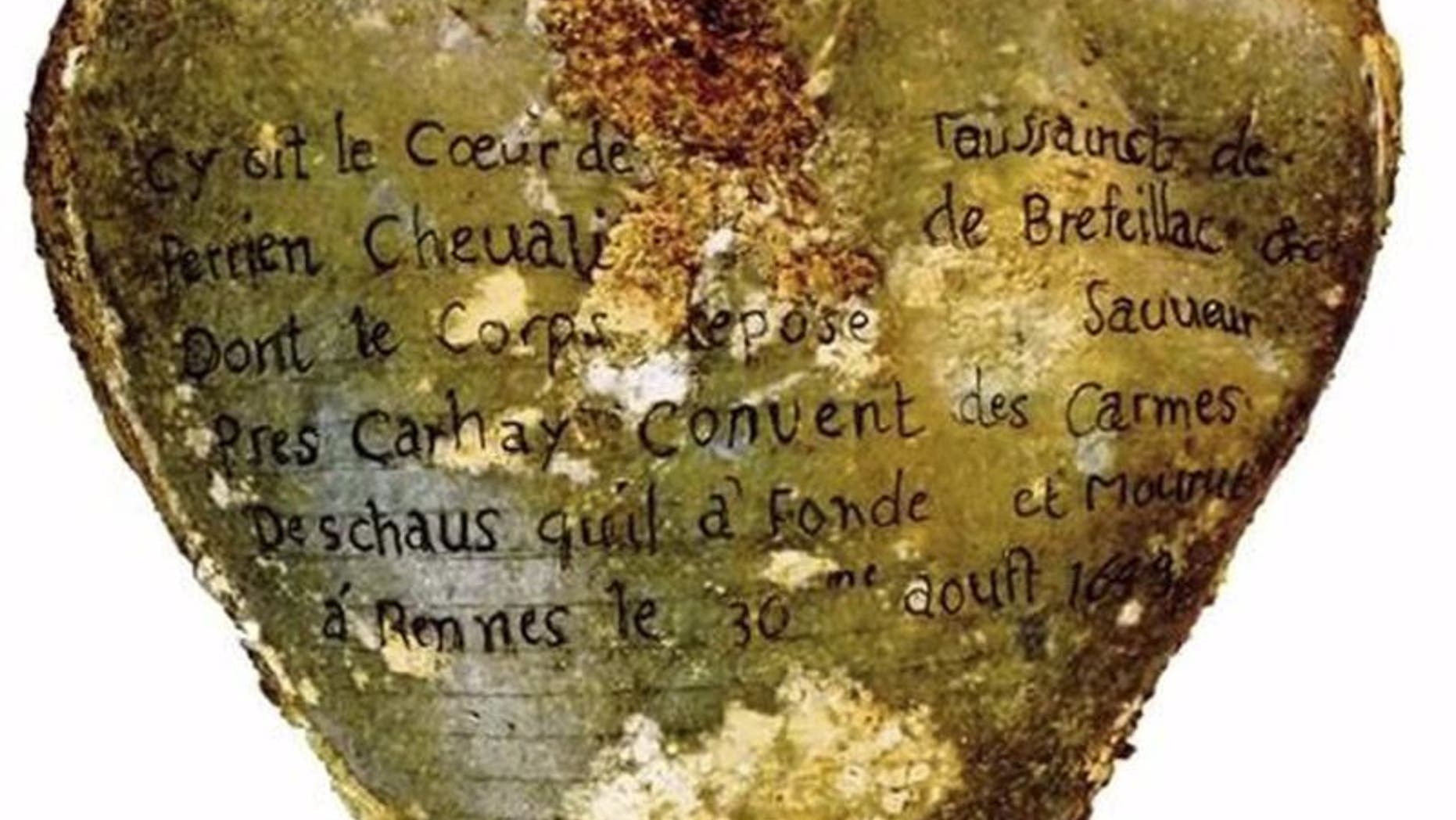 A heart-shaped lead urn with an inscription identifying the contents as the heart of Toussaint Perrien, Knight of Brefeillac, found during excavation of the ruins of the medieval Jacobins convent in Rennes, France is shown in this handout photo provided by Rozenn Colleter on December 2, 2015. REUTERS/Rozenn Colleter/Ph.D./INRAP/Handout via Reuters