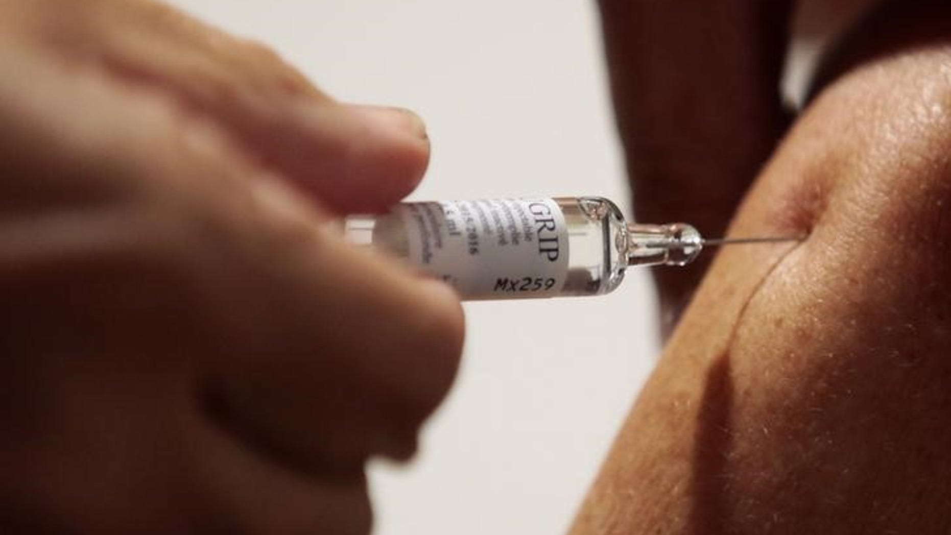 A nurse vaccinates a patient as part of the start of the seasonal influenza vaccination campaign in Nice, southeastern France, October 21, 2015. REUTERS/Eric Gaillard
