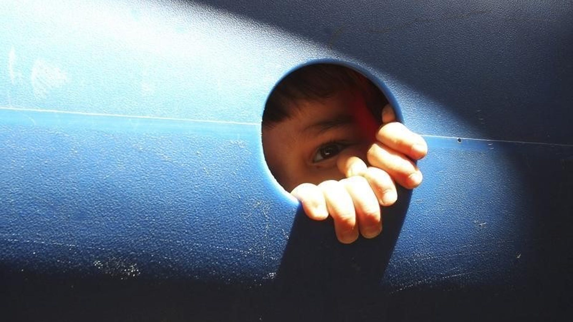 A young cancer patient plays at the opening of a summer camp outside the King Hussein Cancer center in Amman July 1, 2012. REUTERS/Ali Jarekji