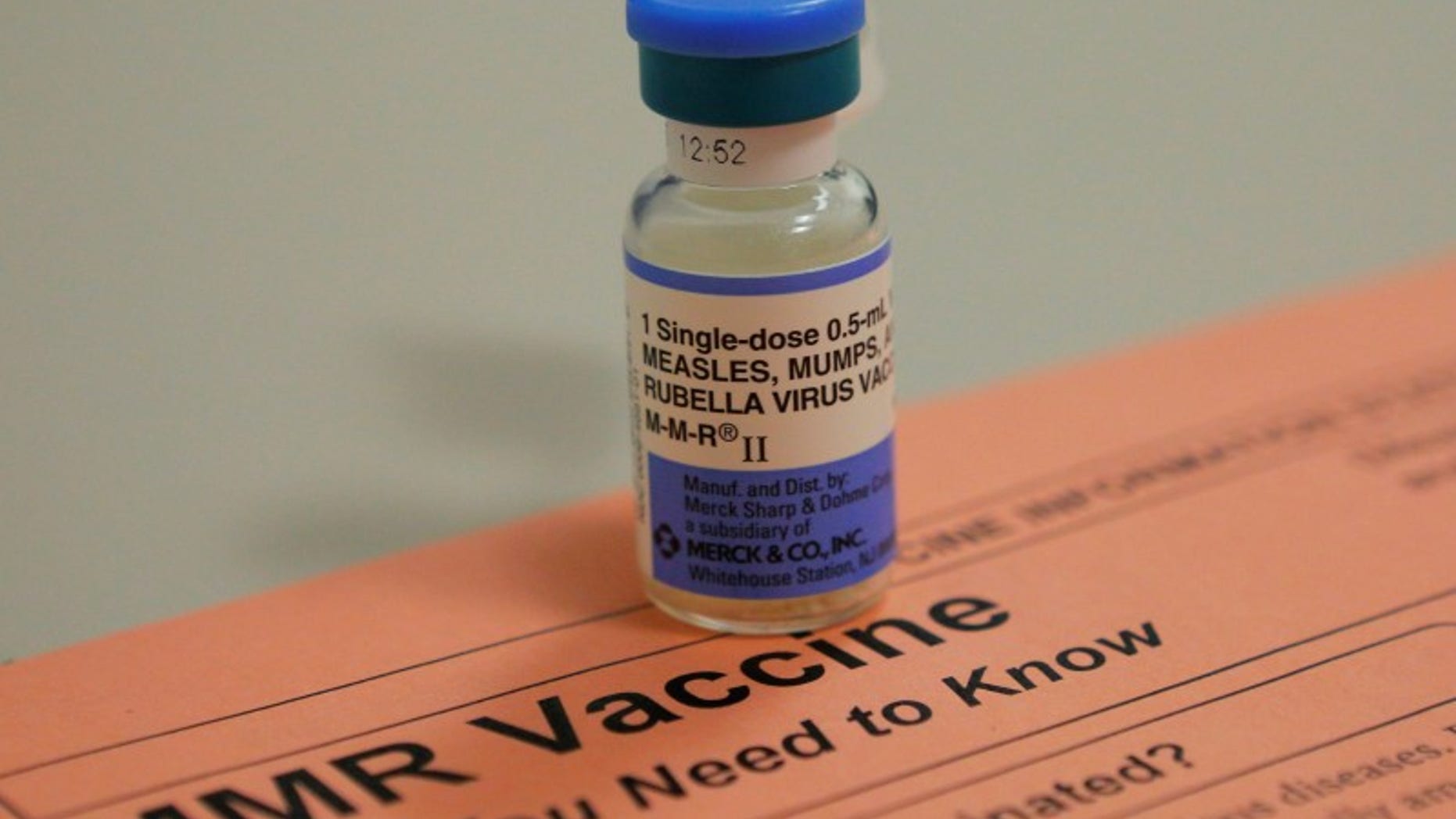 A vial of measles, mumps and rubella vaccine and an information sheet is seen at Boston Children's Hospital in Boston