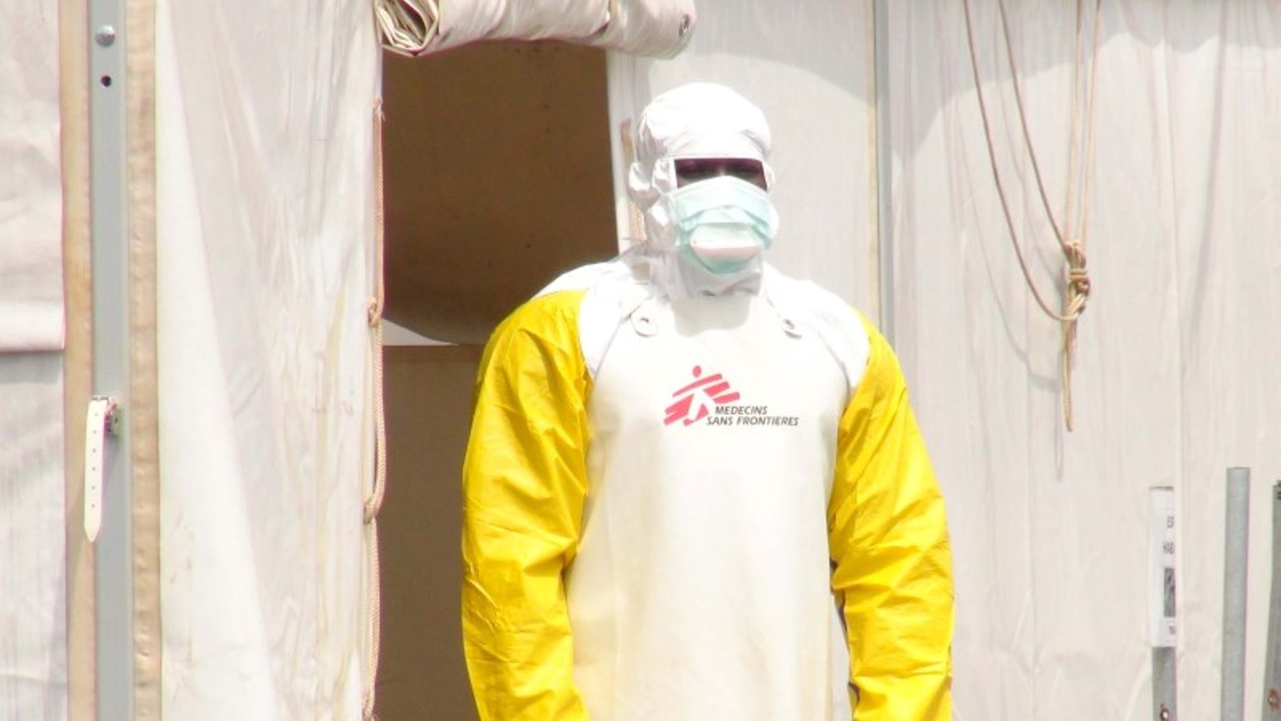 A Doctors Without Borders health worker stands in an Ebola virus treatment center in Conakry